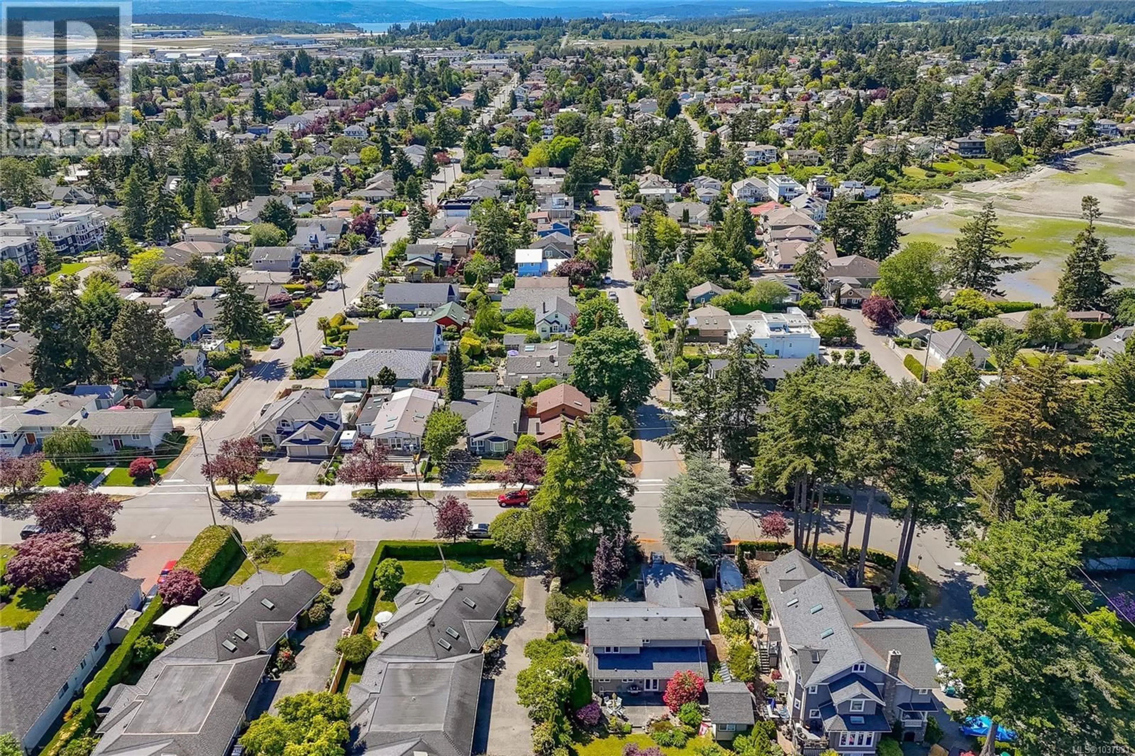 A pic from outside/outdoor area/front of a property/back of a property/a pic from drone, street for 10210 THIRD STREET, Sidney British Columbia V8L3B9