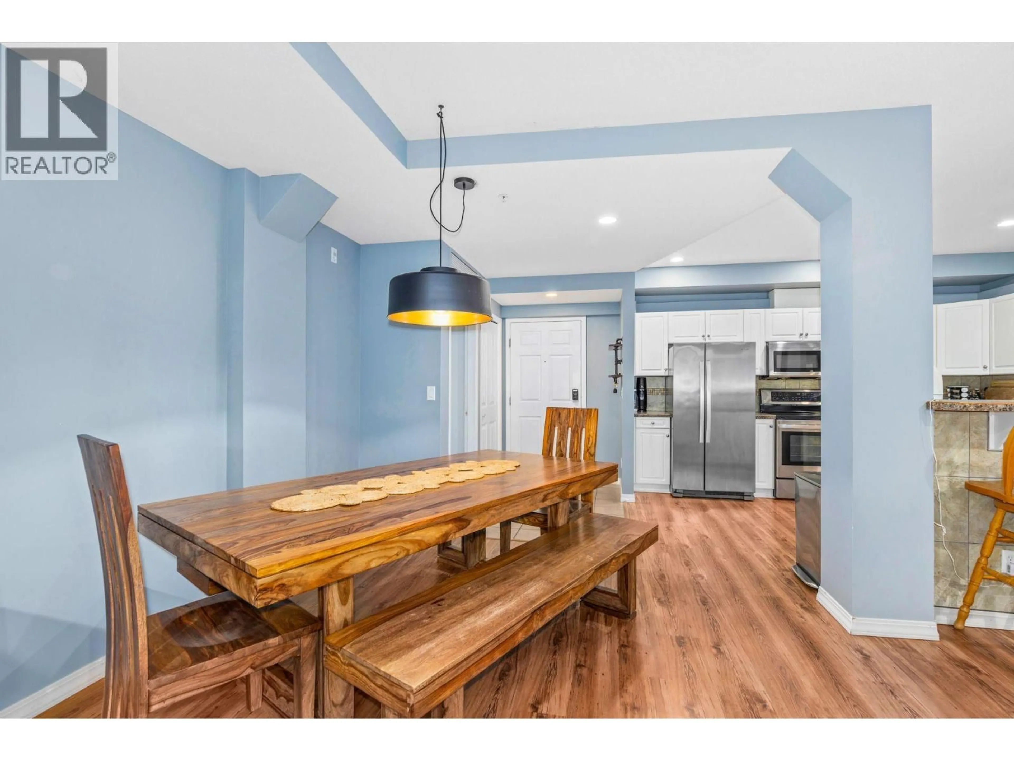 Open concept kitchen, wood/laminate floor for 208 - 1088 SUNSET DRIVE, Kelowna British Columbia V1Y9W1