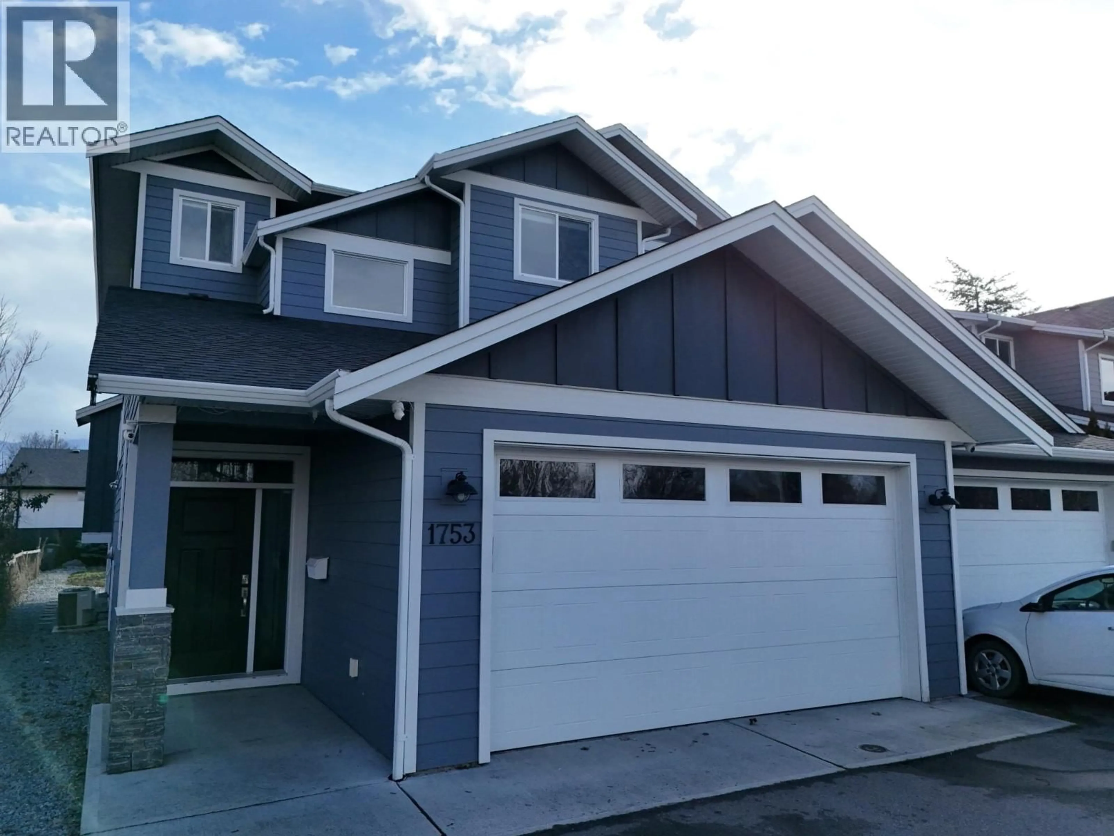 Home with vinyl exterior material, street for 1753 KLO ROAD, Kelowna British Columbia V1W3P3