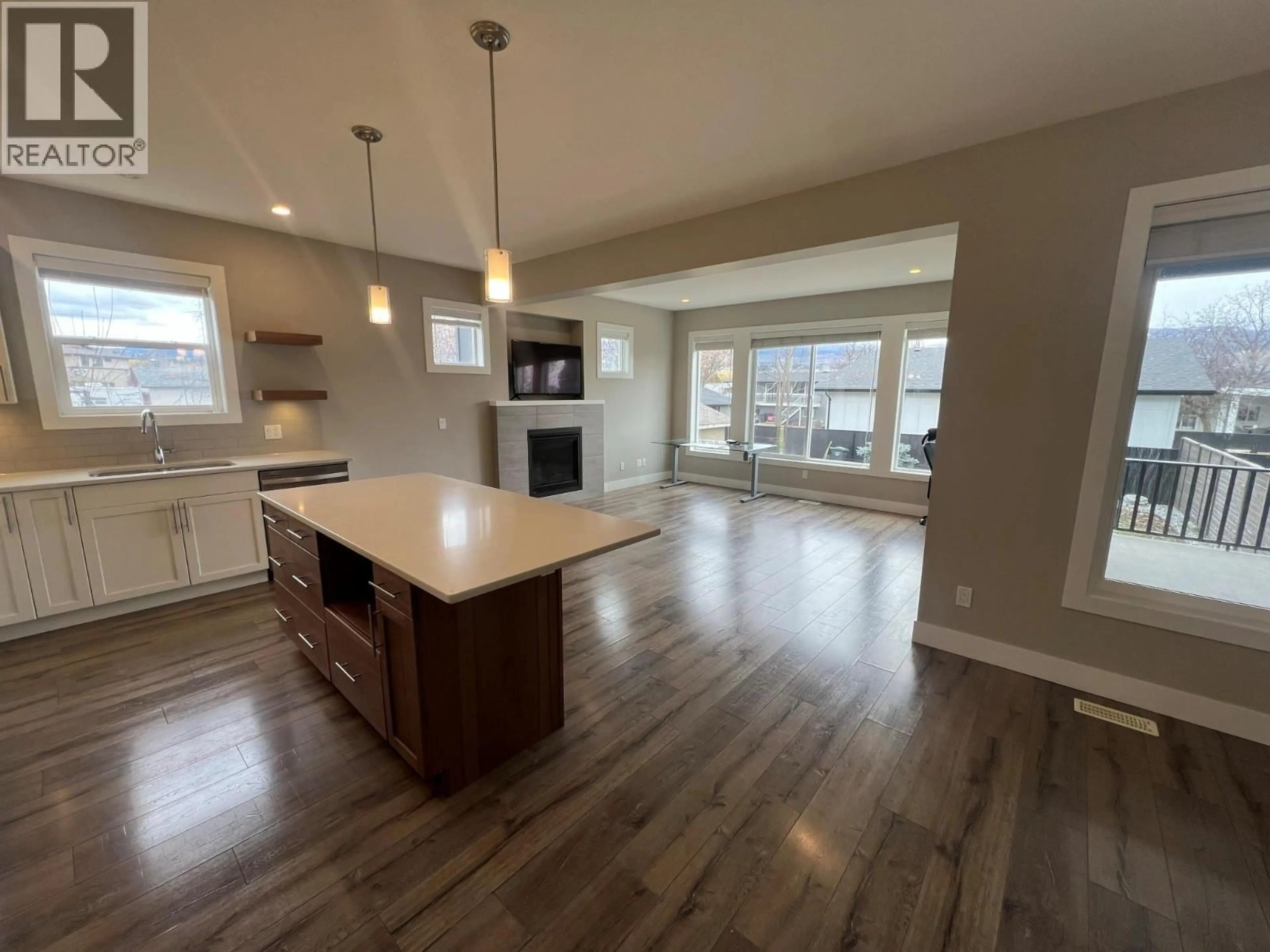 Open concept kitchen, wood/laminate floor for 1753 KLO ROAD, Kelowna British Columbia V1W3P3