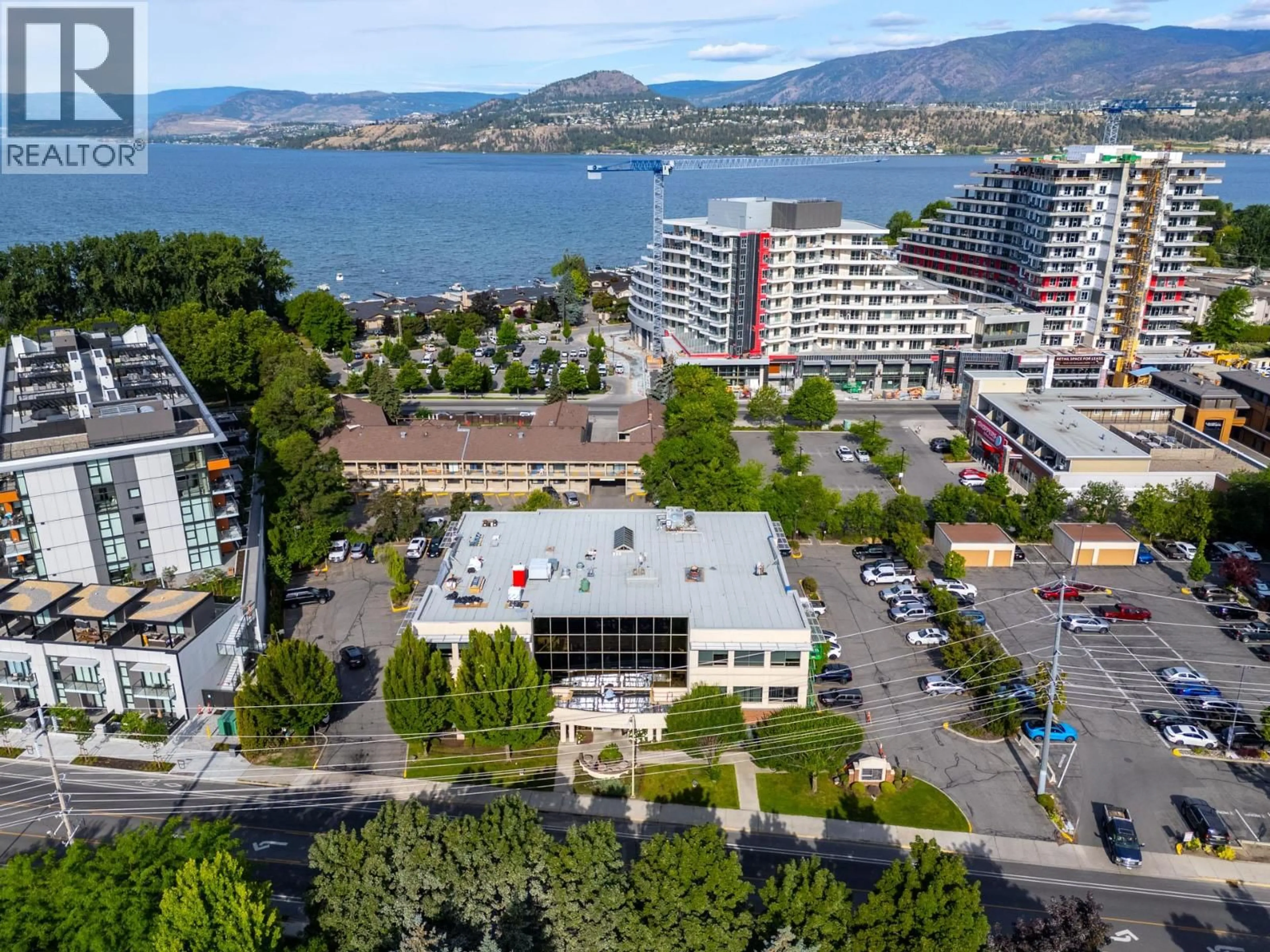 A pic from outside/outdoor area/front of a property/back of a property/a pic from drone, water/lake/river/ocean view for 107 - 3330 RICHTER STREET, Kelowna British Columbia V1W4V5