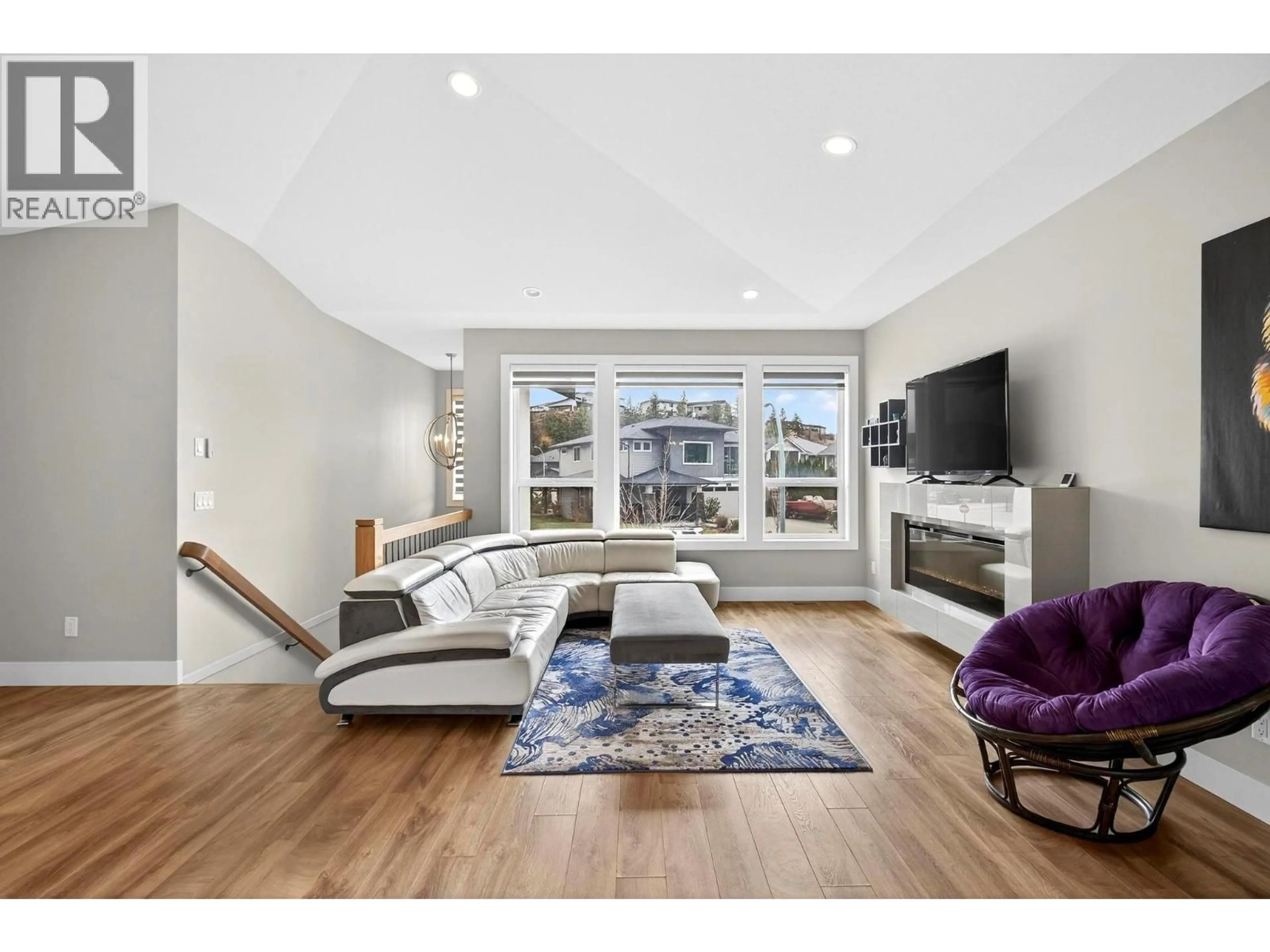 Living room with furniture, wood/laminate floor for 3006 IRONRIDGE PLACE, West Kelowna British Columbia V4T3L5