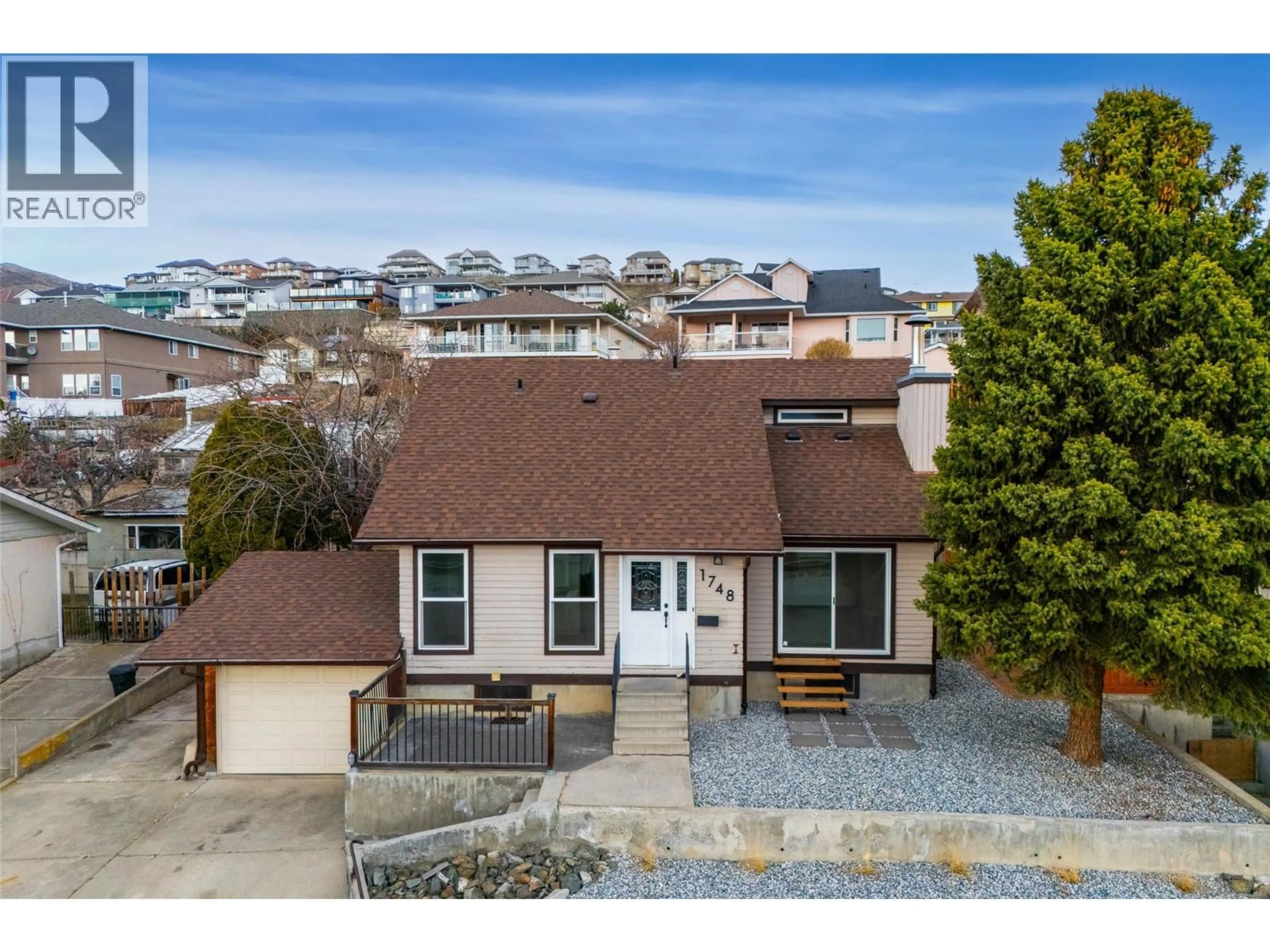A pic from outside/outdoor area/front of a property/back of a property/a pic from drone, street for 1748 NORTH RIVER DRIVE, Kamloops British Columbia V2B7N7