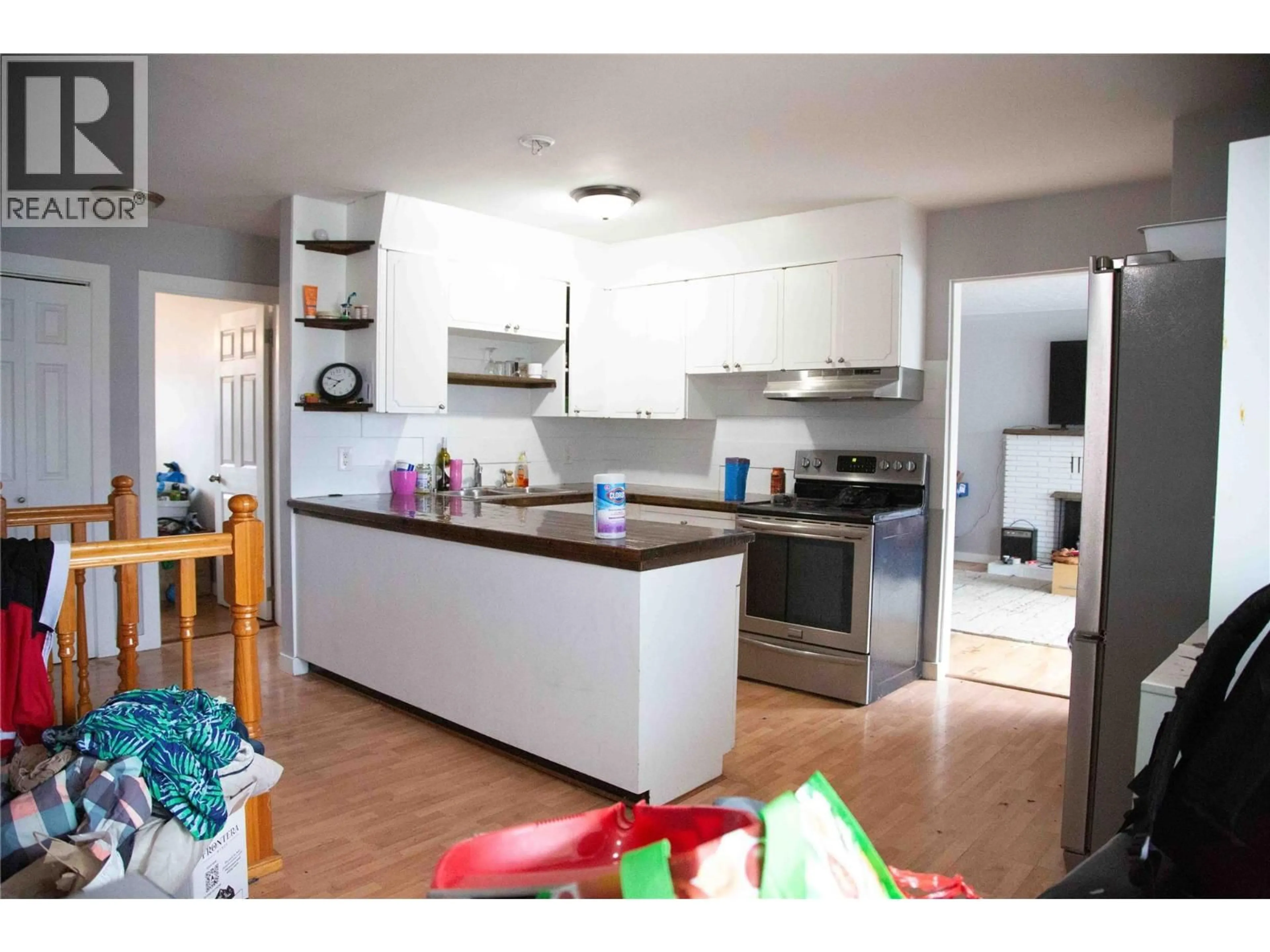 Open concept kitchen, wood/laminate floor for 514 EDNA AVENUE, Penticton British Columbia V2A2M2