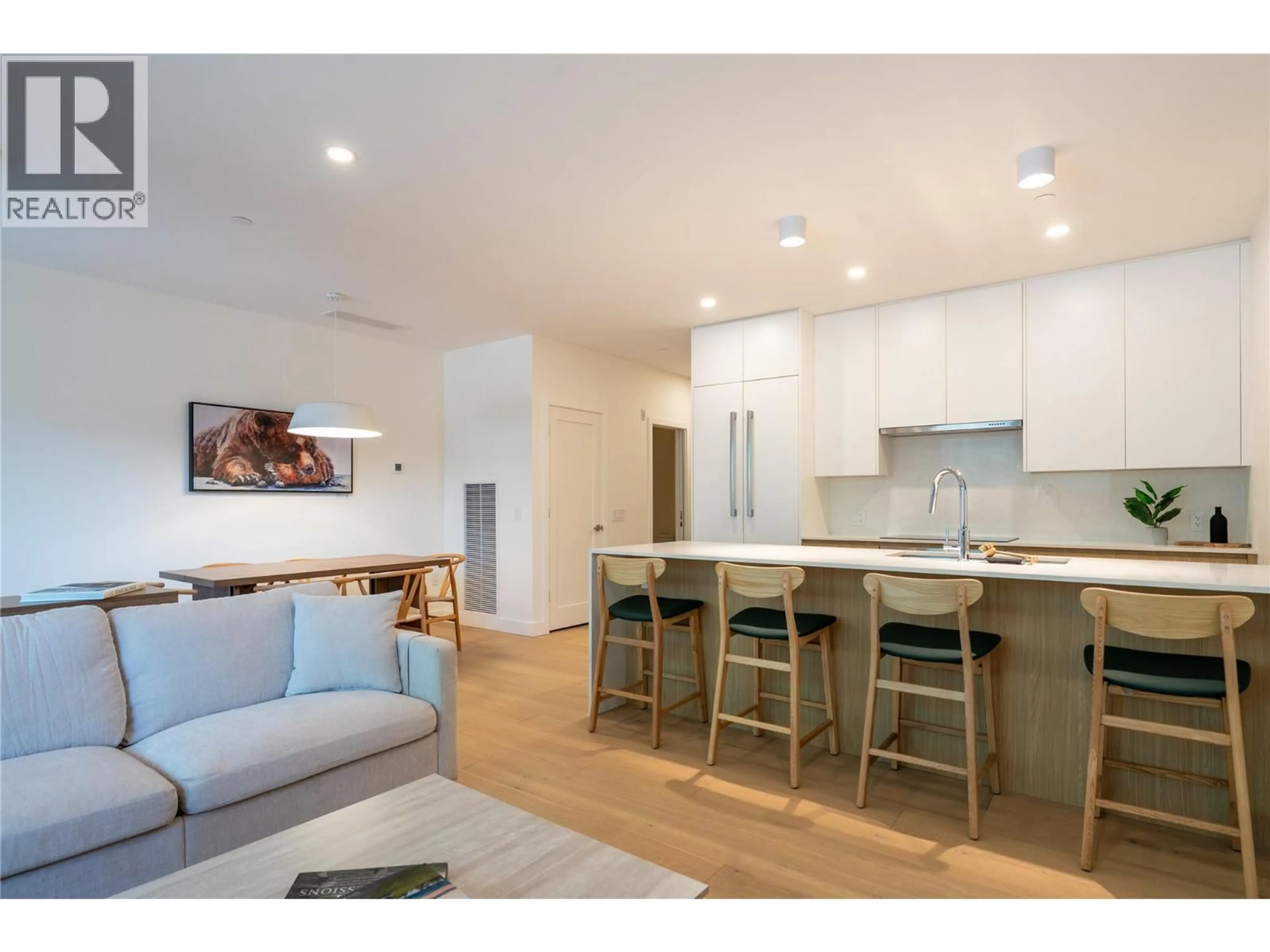 Open concept kitchen, wood/laminate floor for 1111 - 1702 COURSIER AVENUE, Revelstoke British Columbia V0E2S3