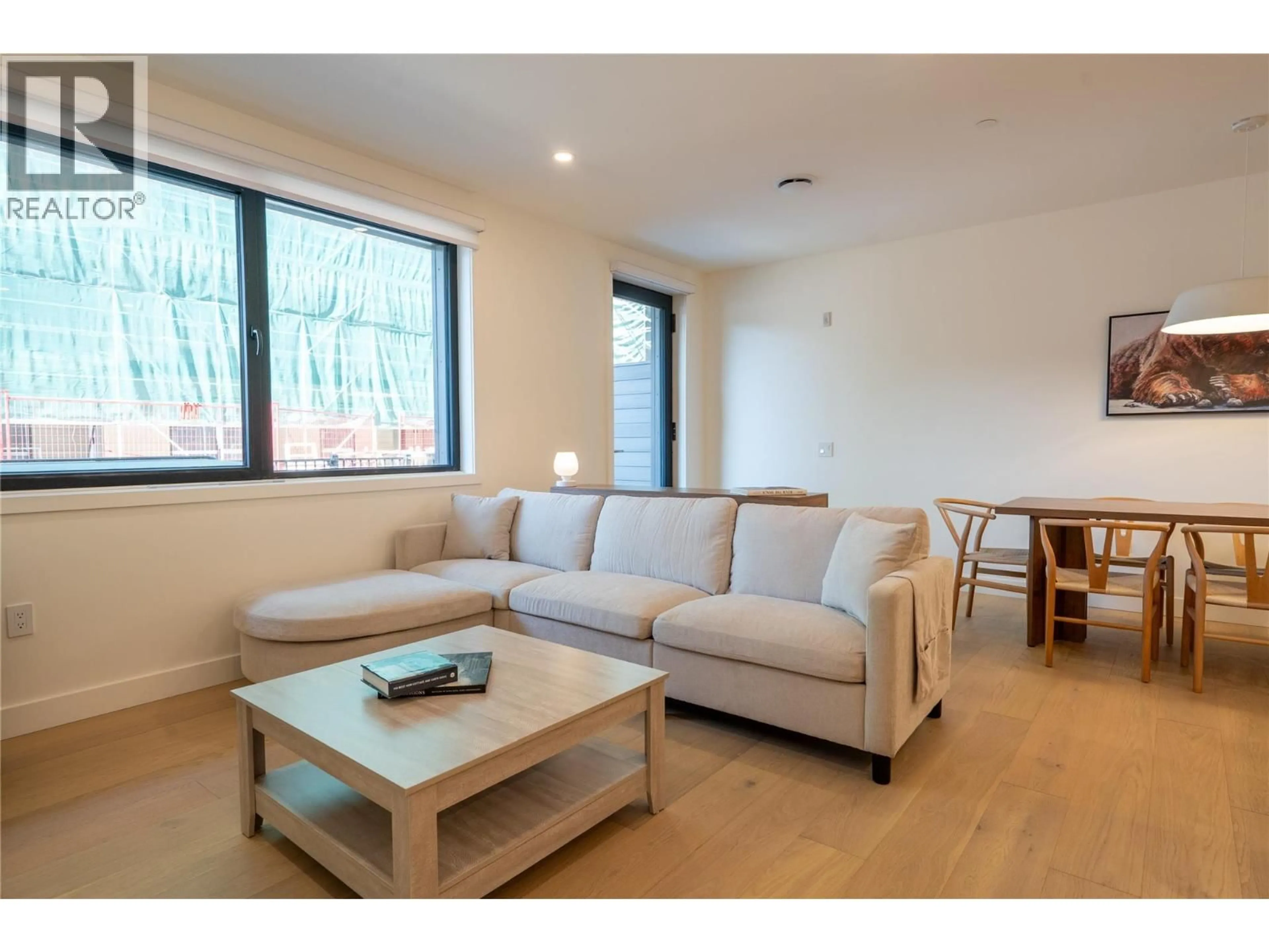 Living room with furniture, wood/laminate floor for 1111 - 1702 COURSIER AVENUE, Revelstoke British Columbia V0E2S3