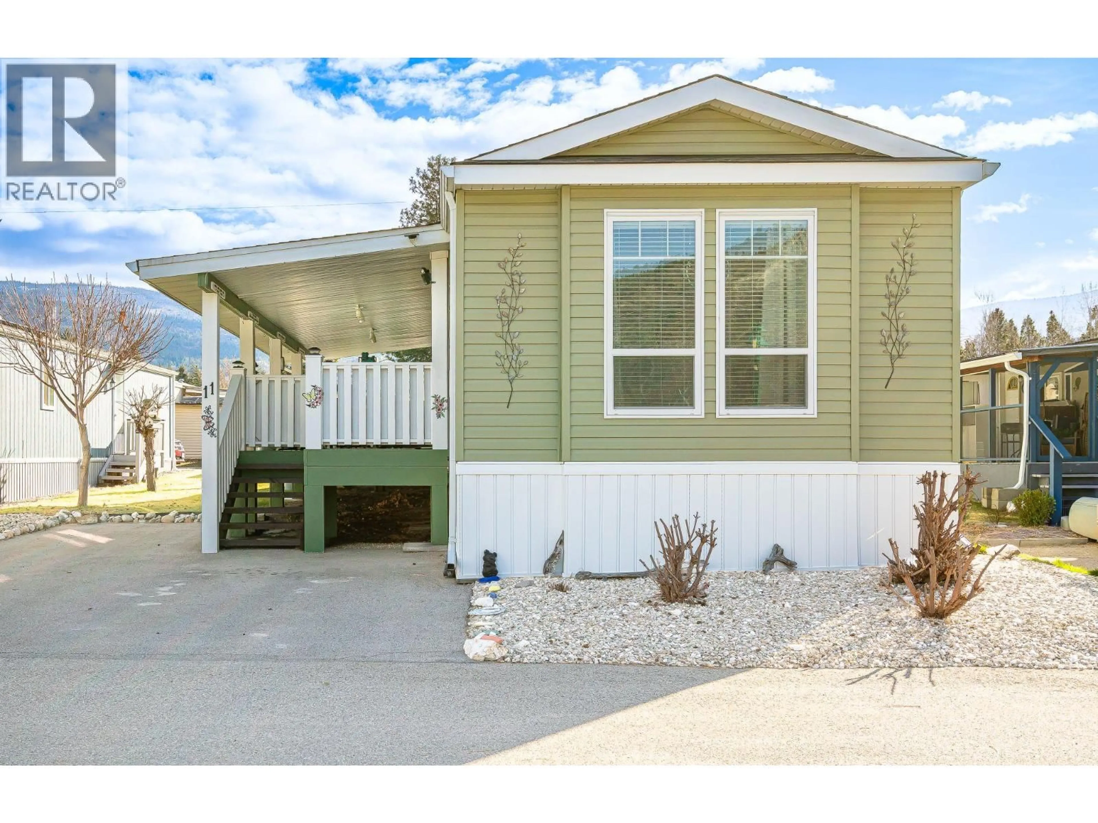 Home with vinyl exterior material, street for C11 - 4505 MCLEAN CREEK ROAD, Okanagan Falls British Columbia V0H1R1