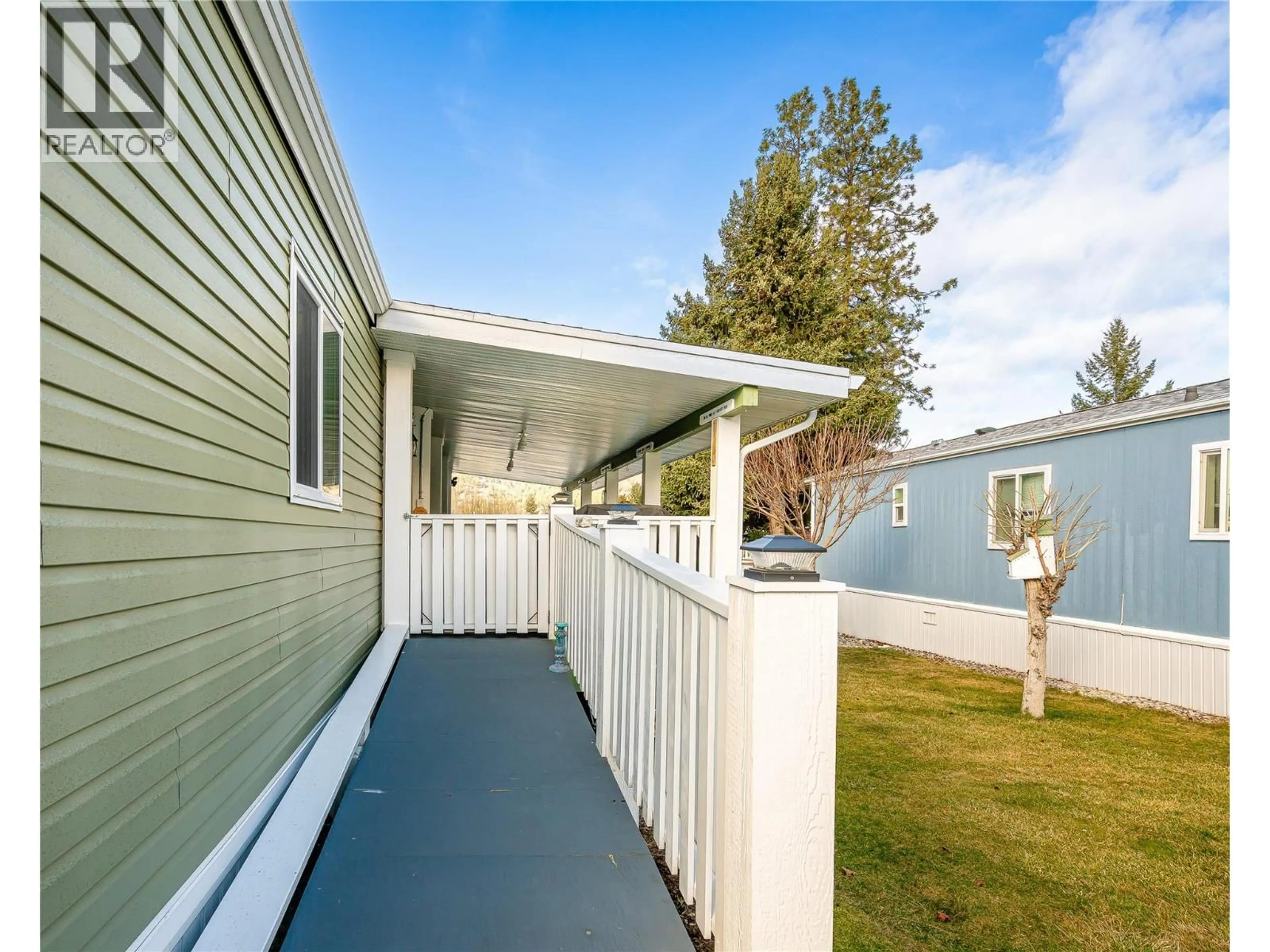 Home with vinyl exterior material, street for C11 - 4505 MCLEAN CREEK ROAD, Okanagan Falls British Columbia V0H1R1