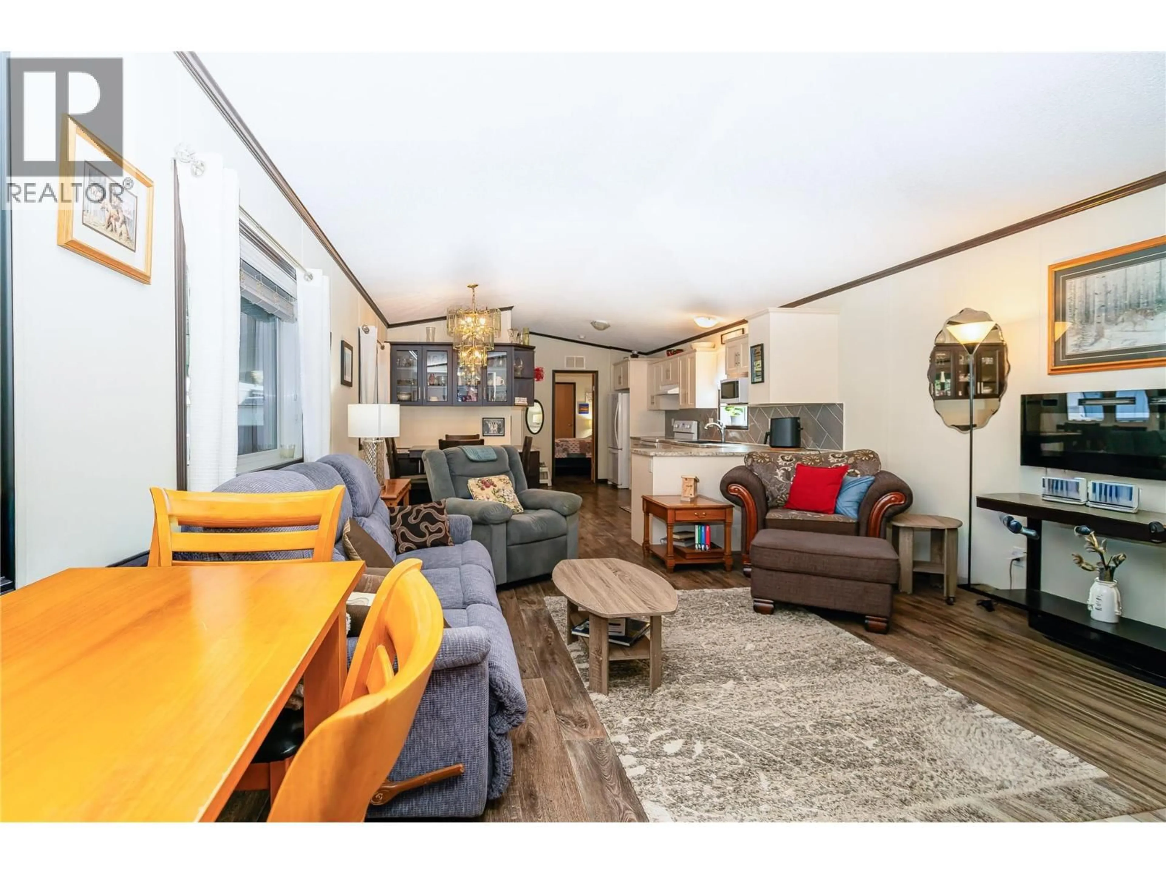 Living room with furniture, wood/laminate floor for C11 - 4505 MCLEAN CREEK ROAD, Okanagan Falls British Columbia V0H1R1