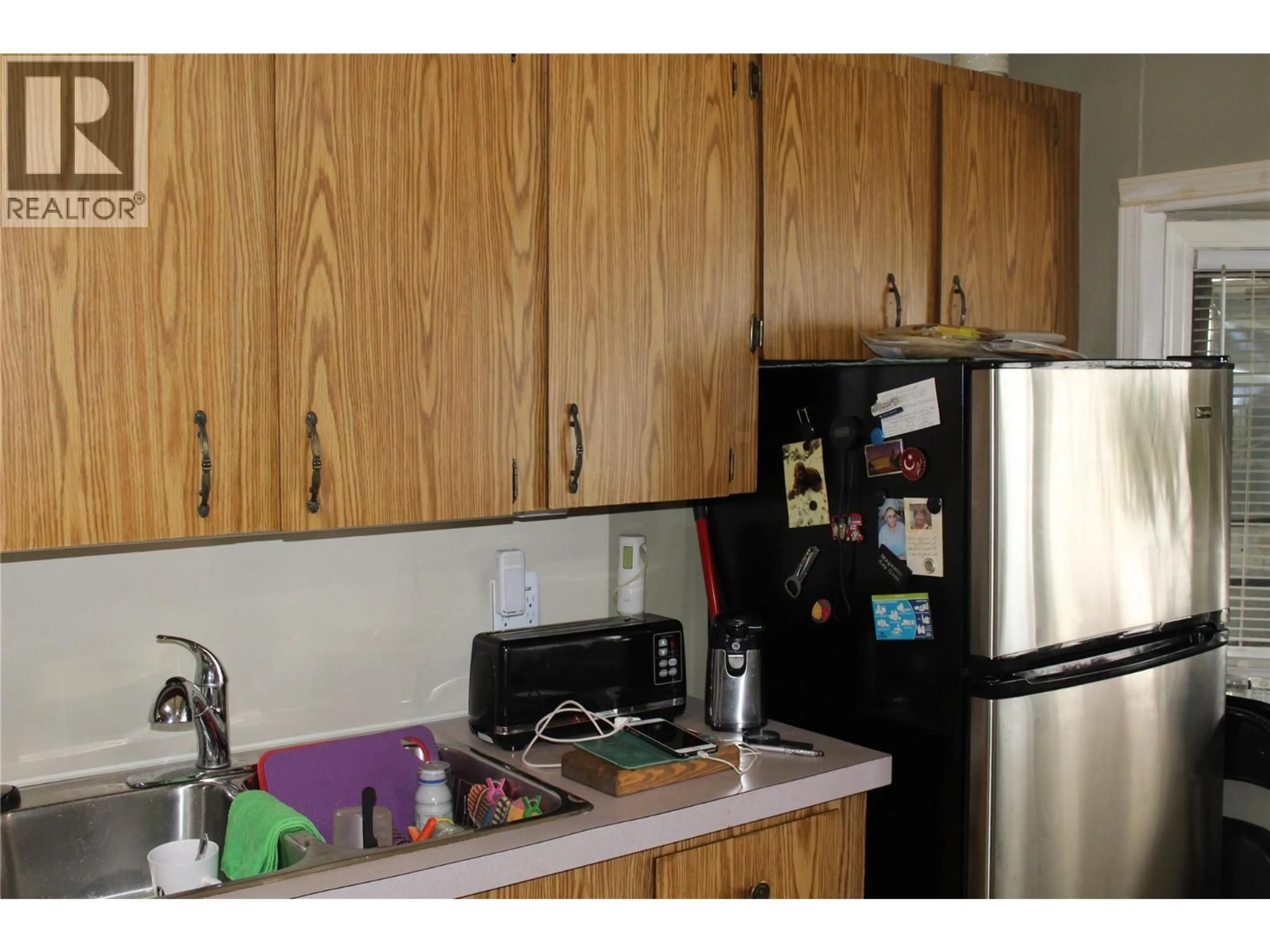 Standard kitchen, wood/laminate floor for 5280 69 AVENUE NORTHEAST, Salmo British Columbia V0E1K0