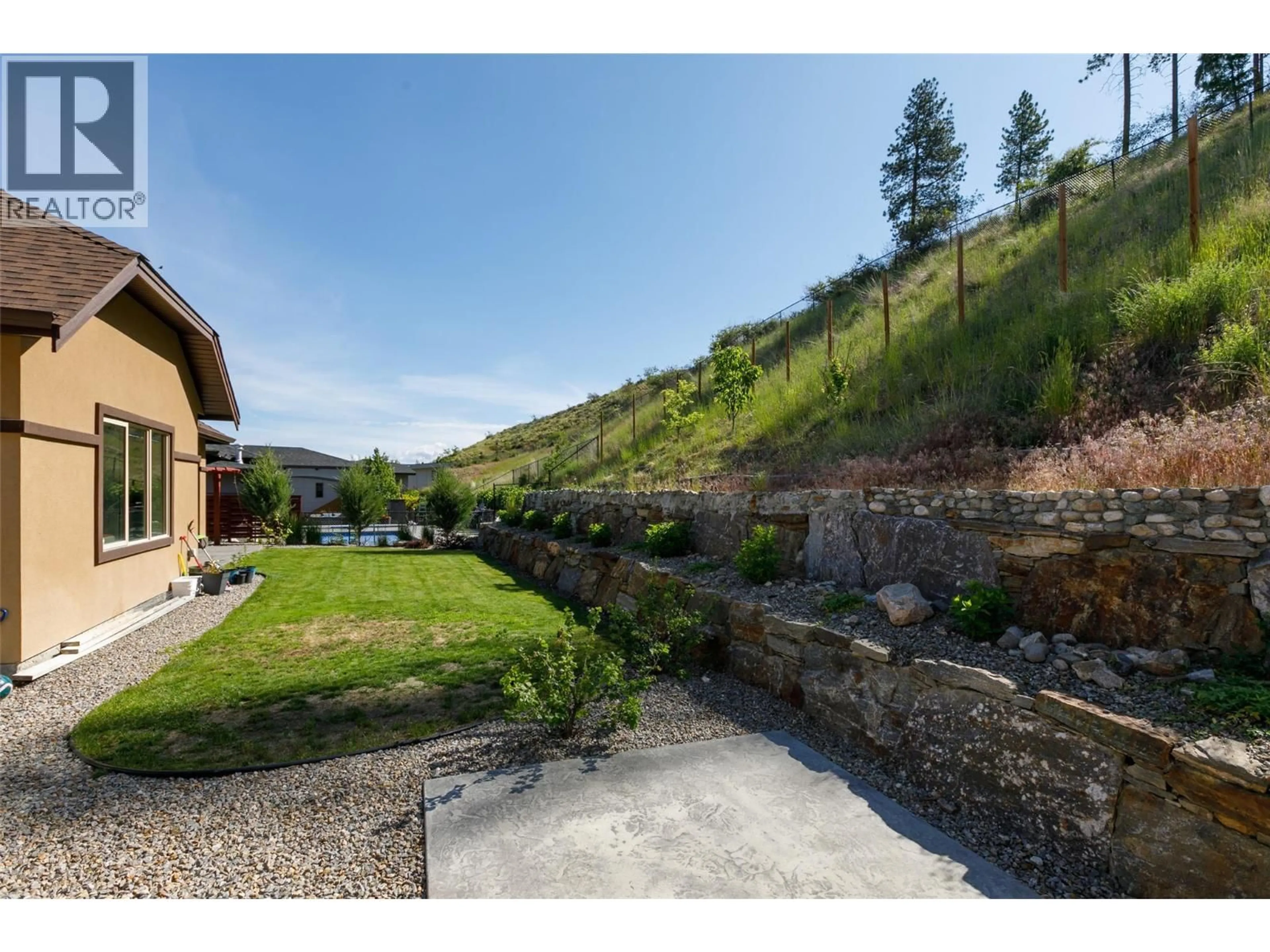 A pic from outside/outdoor area/front of a property/back of a property/a pic from drone, mountain view for 5639 JASPER WAY, Kelowna British Columbia V1W5L7