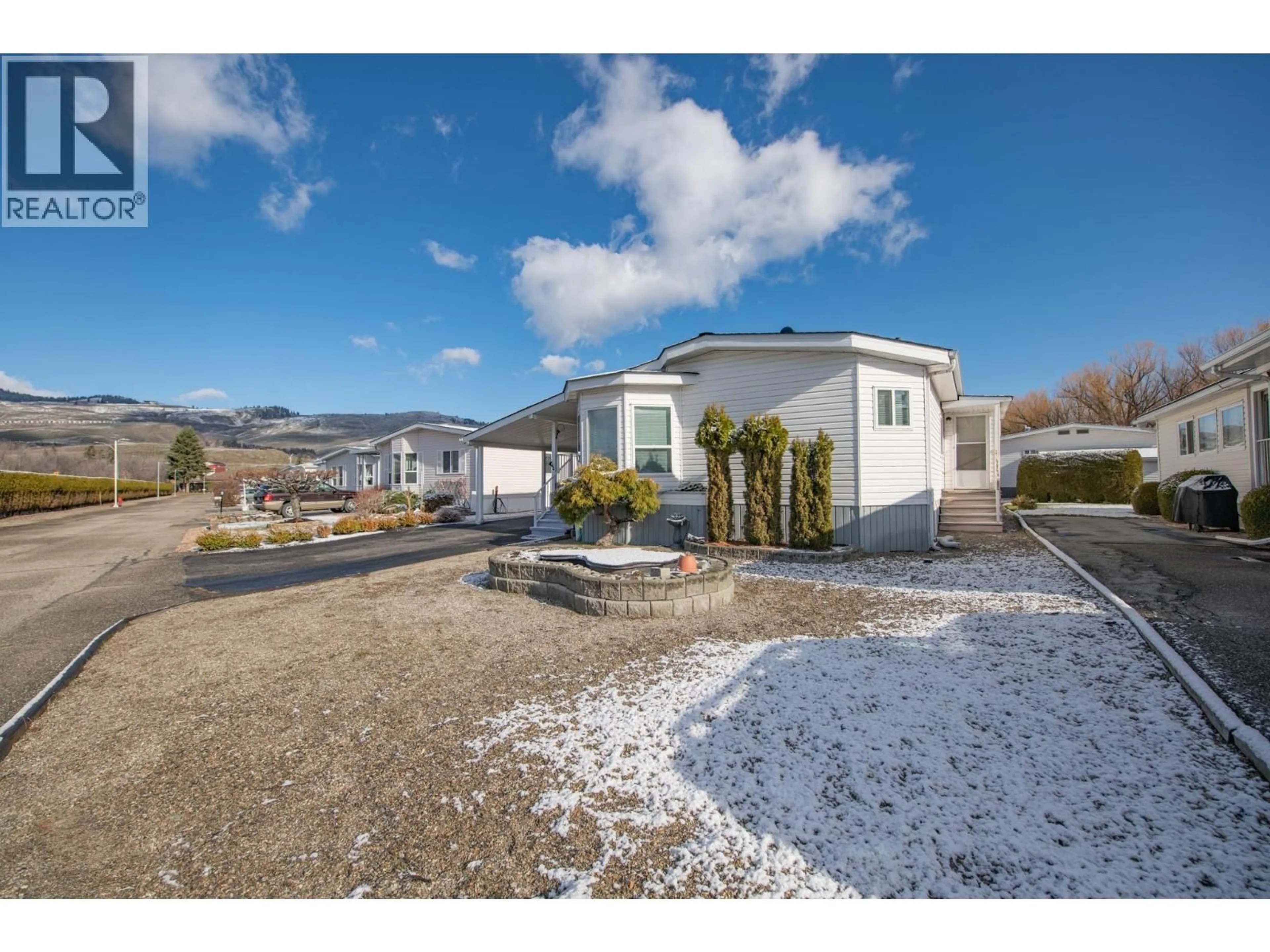 A pic from outside/outdoor area/front of a property/back of a property/a pic from drone, mountain view for 130 - 5484 25 AVENUE, Vernon British Columbia V1T7A8