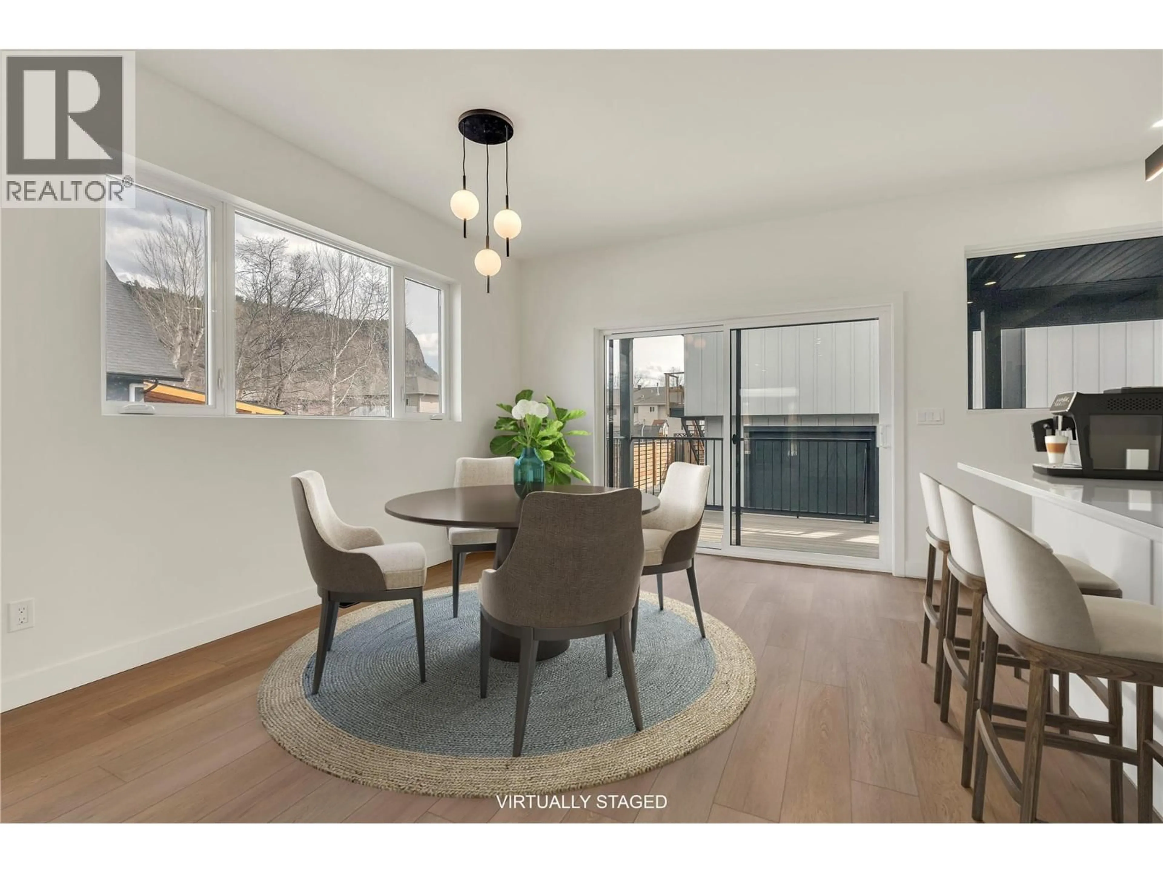 Dining room, wood/laminate floor for 101 - 10907 PRAIRIE VALLEY ROAD, Summerland British Columbia V0H1Z8