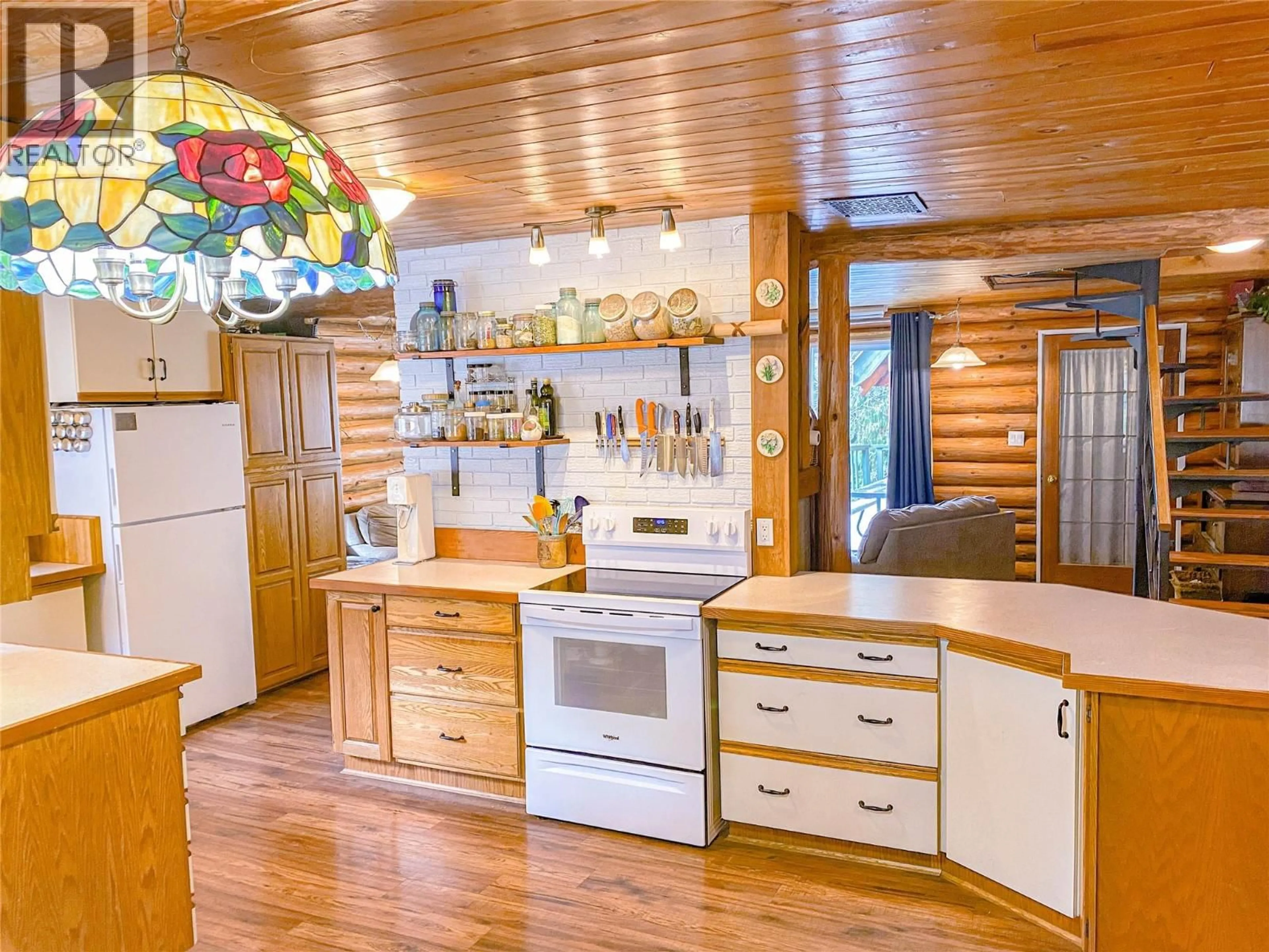 Open concept kitchen, wood/laminate floor for 375 ALEXANDER ROAD, Nakusp British Columbia V0G1R1