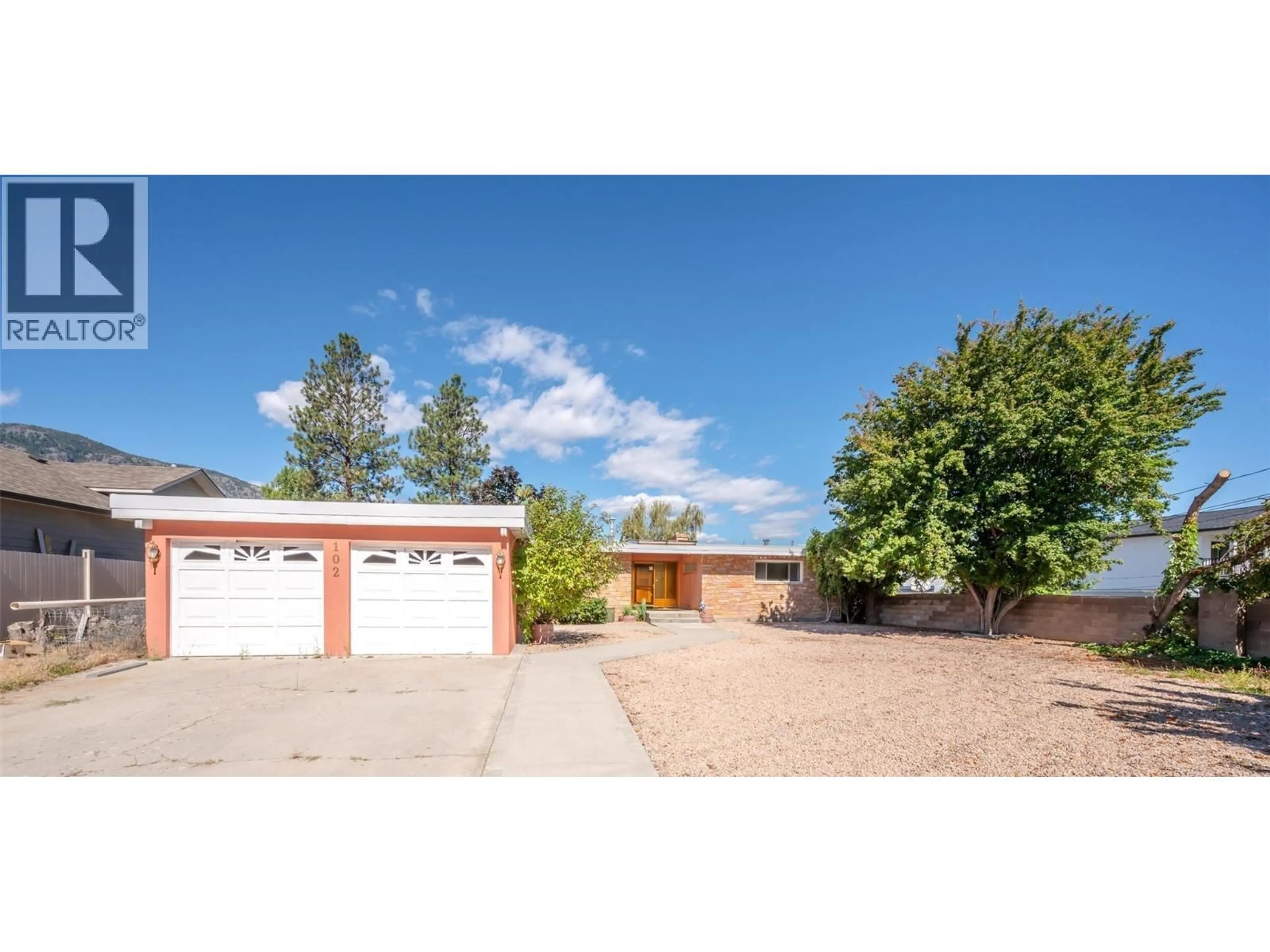 A pic from outside/outdoor area/front of a property/back of a property/a pic from drone, street for 102 DERENZY PLACE, Penticton British Columbia V2A8W7