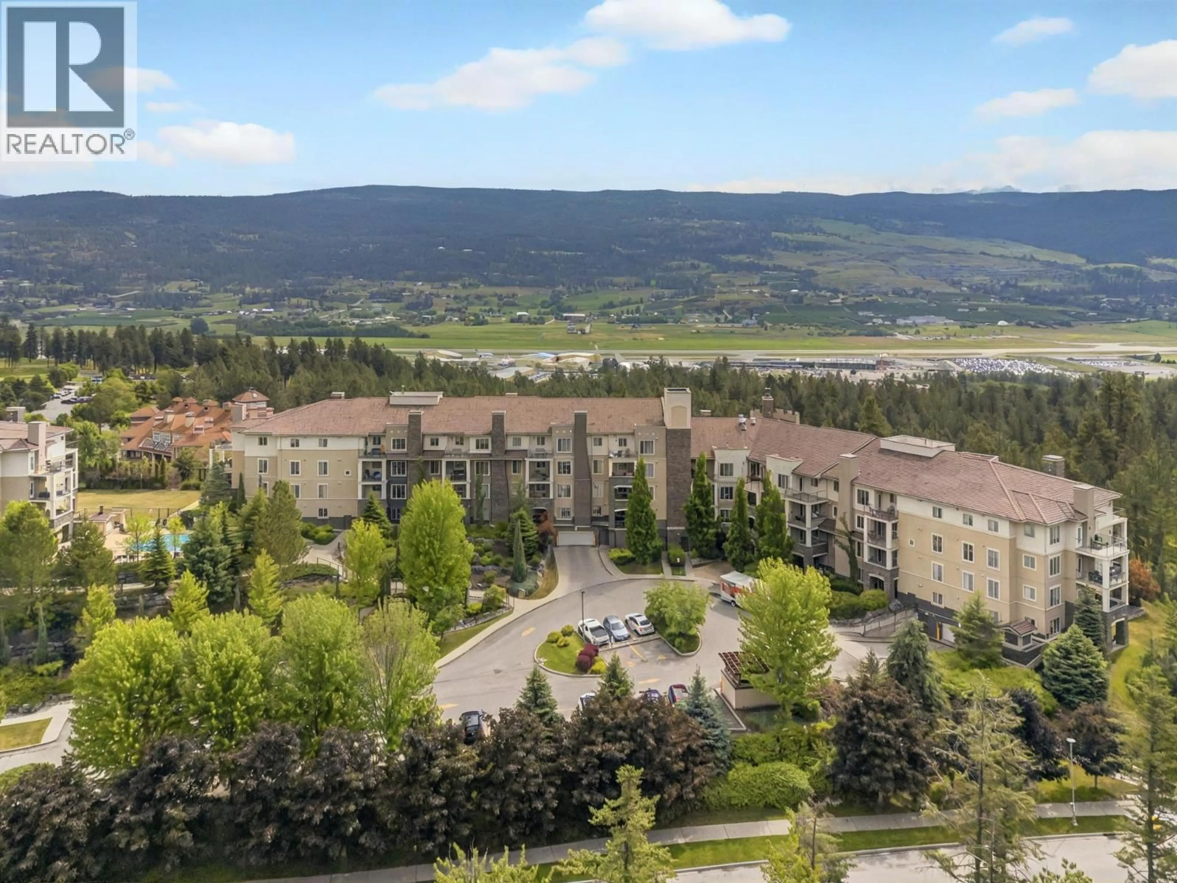 A pic from outside/outdoor area/front of a property/back of a property/a pic from drone, mountain view for 2314 - 1873 COUNTRY CLUB DRIVE, Kelowna British Columbia V1V2W6
