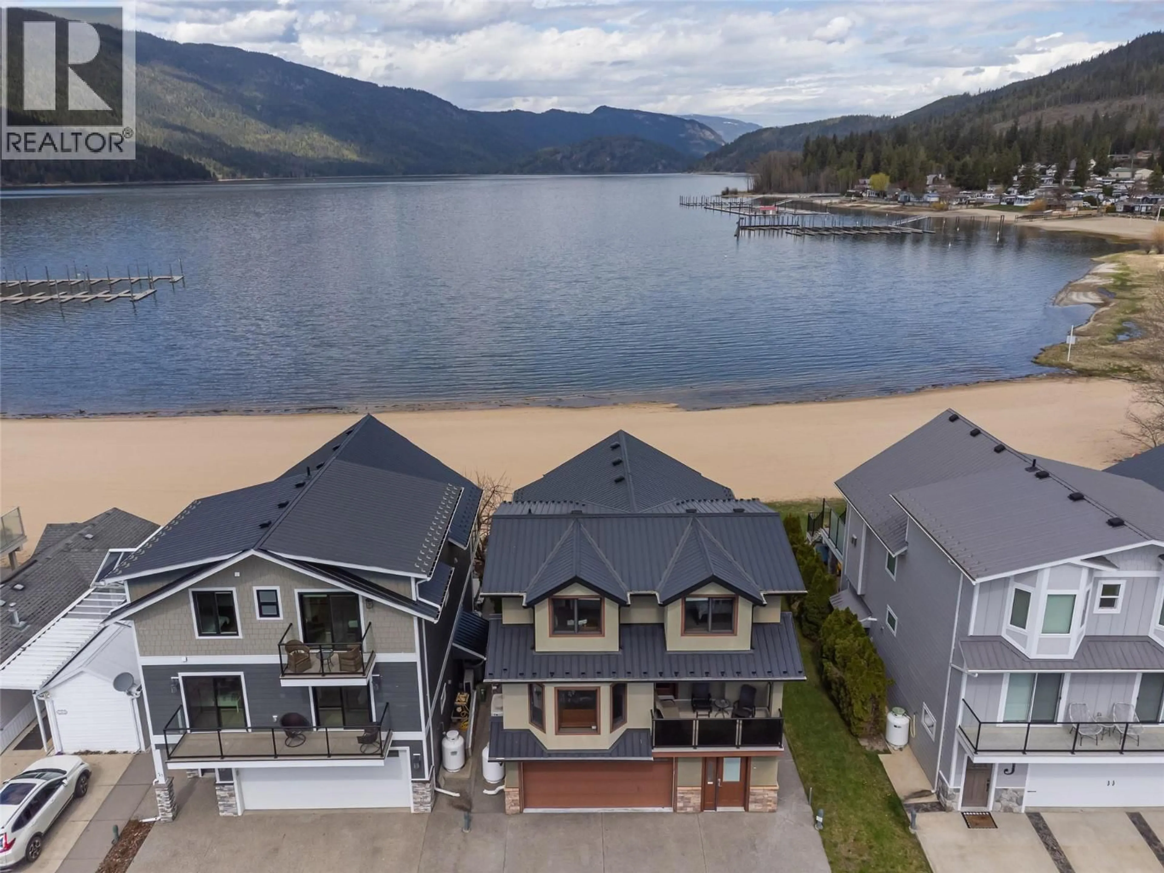 A pic from outside/outdoor area/front of a property/back of a property/a pic from drone, water/lake/river/ocean view for LS44 - 8192 97A HIGHWAY, Mara British Columbia V0E2K0