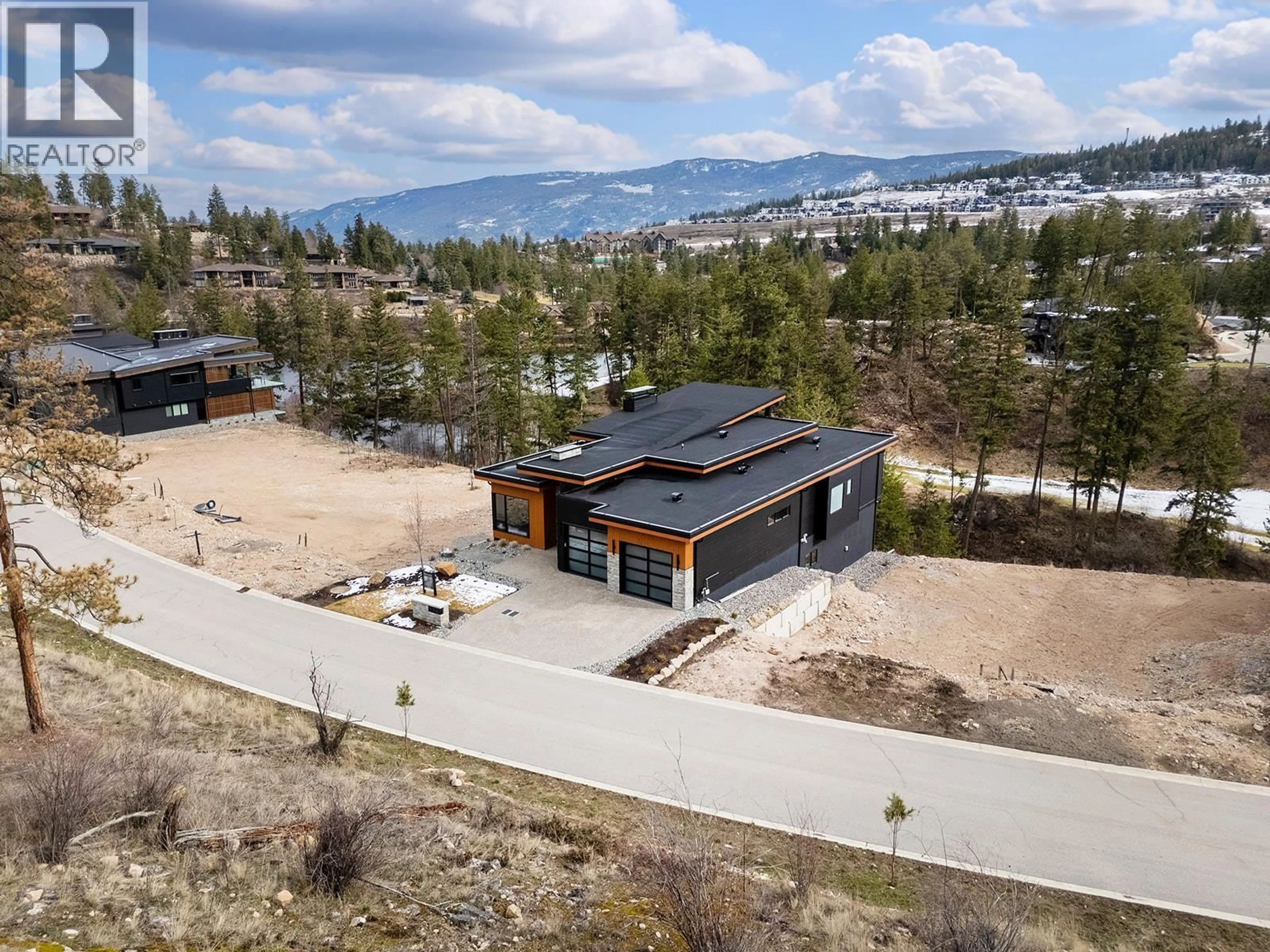 A pic from outside/outdoor area/front of a property/back of a property/a pic from drone, mountain view for 124 WILDSONG CRESCENT WEST, Vernon British Columbia V1H0A8