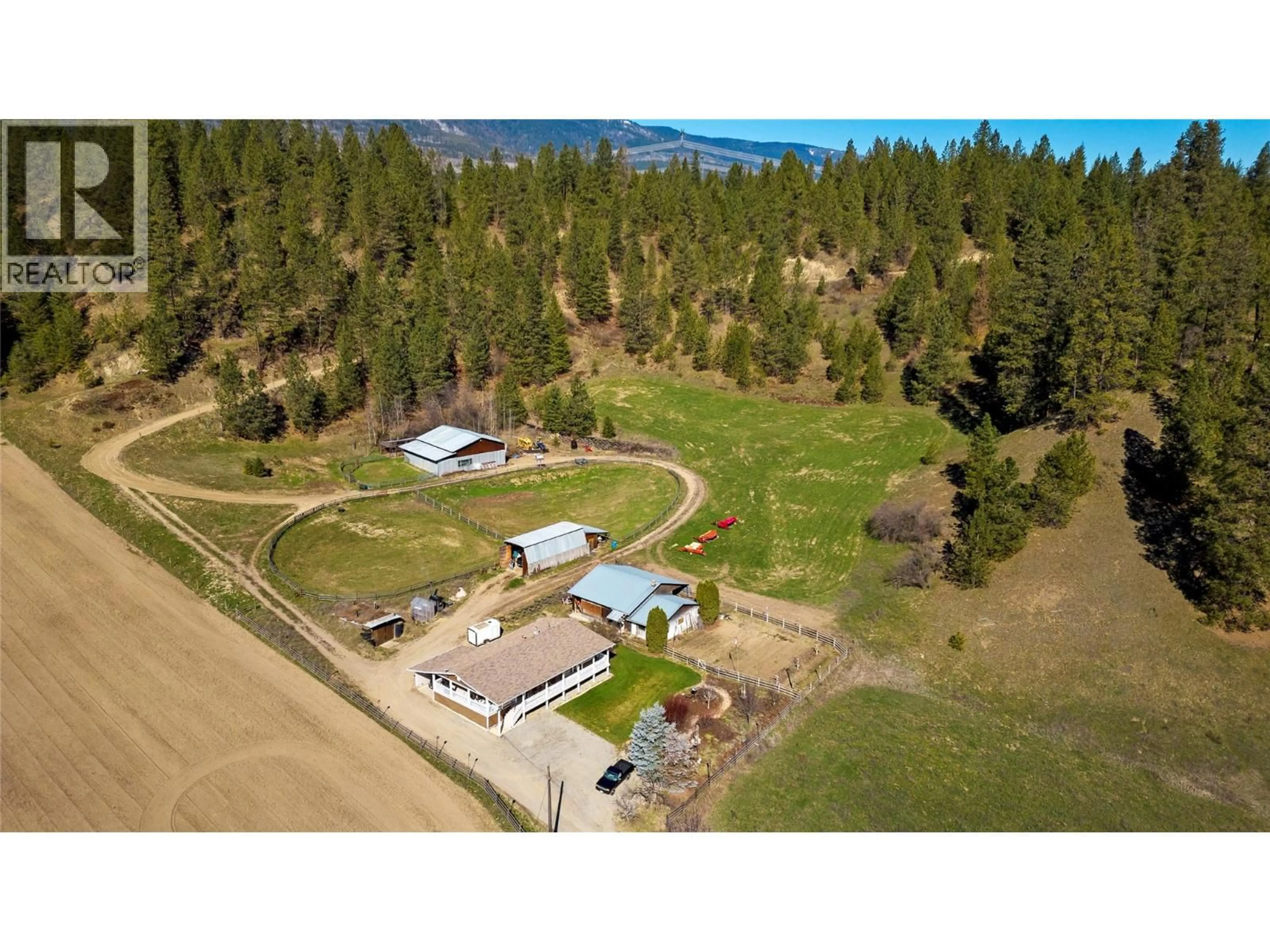 A pic from outside/outdoor area/front of a property/back of a property/a pic from drone, mountain view for 2720 SALMON RIVER ROAD, Salmon Arm British Columbia V1E3H8