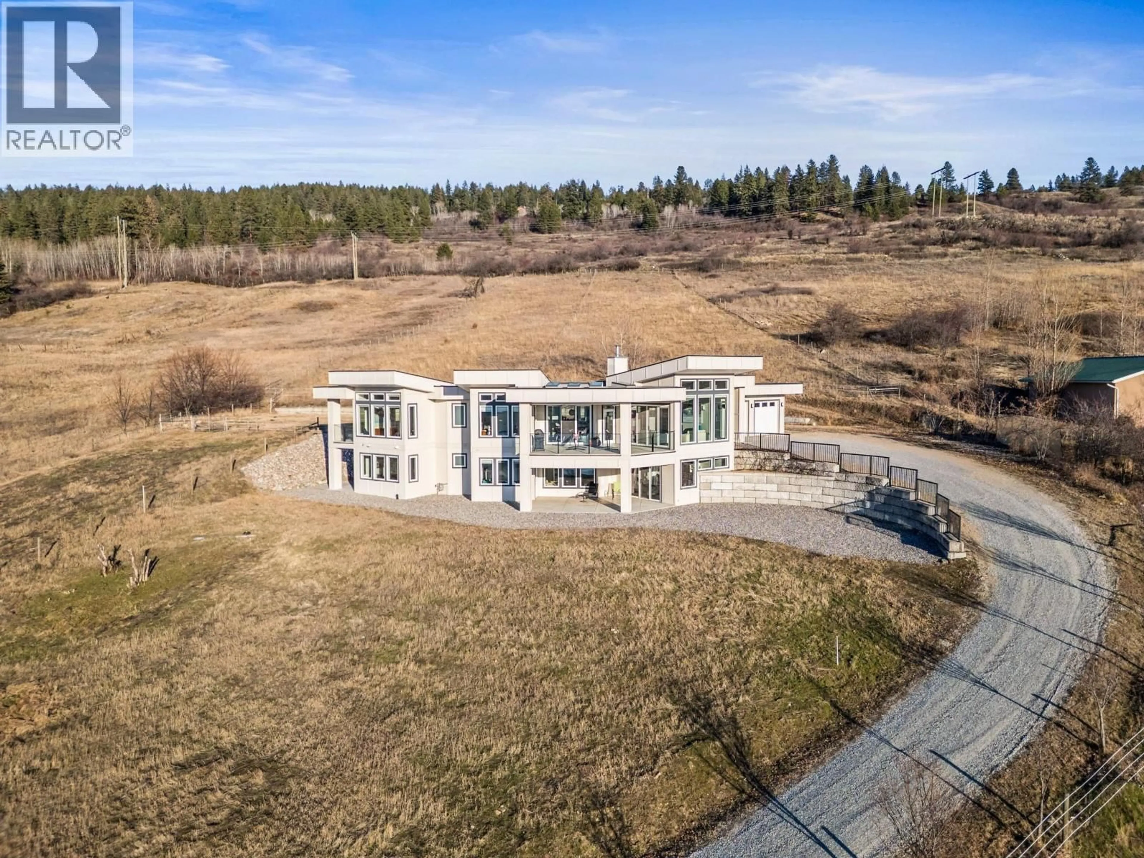 A pic from outside/outdoor area/front of a property/back of a property/a pic from drone, building for 7697 BAKER HOGG ROAD, Vernon British Columbia V1B3S3
