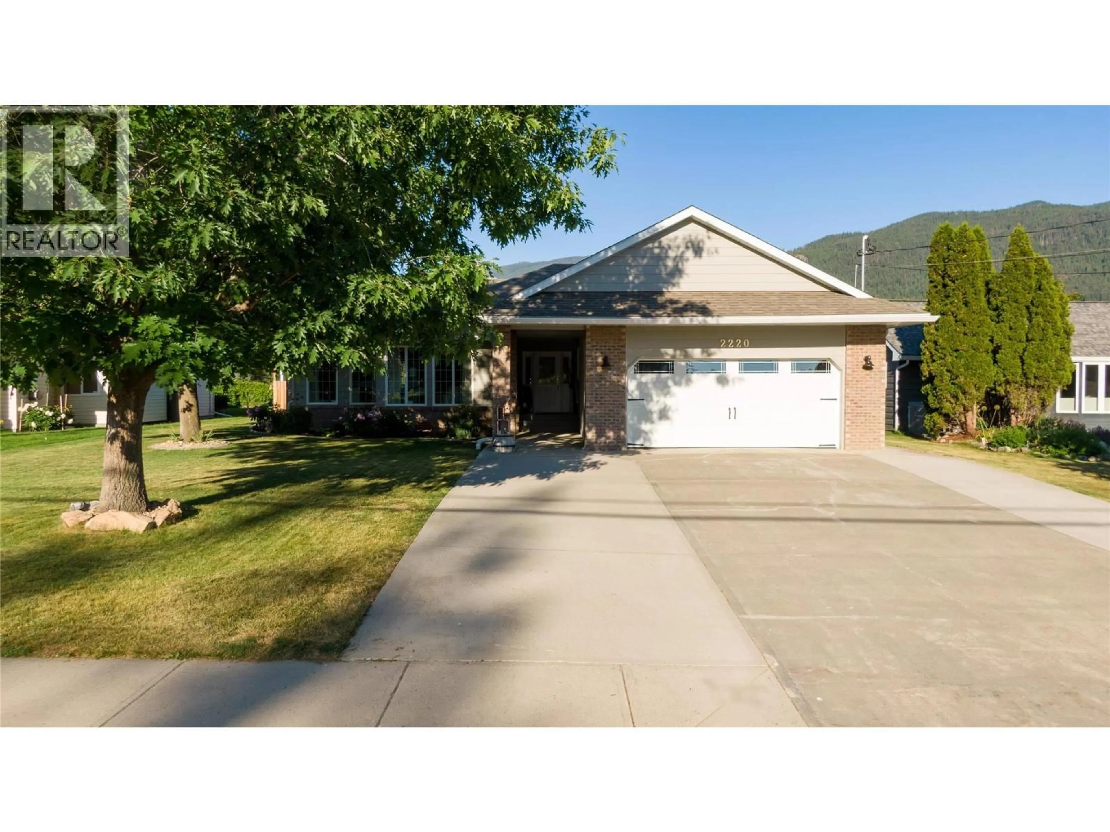 Home with vinyl exterior material, street for 2220 OKANAGAN STREET, Armstrong British Columbia V4Y0B7