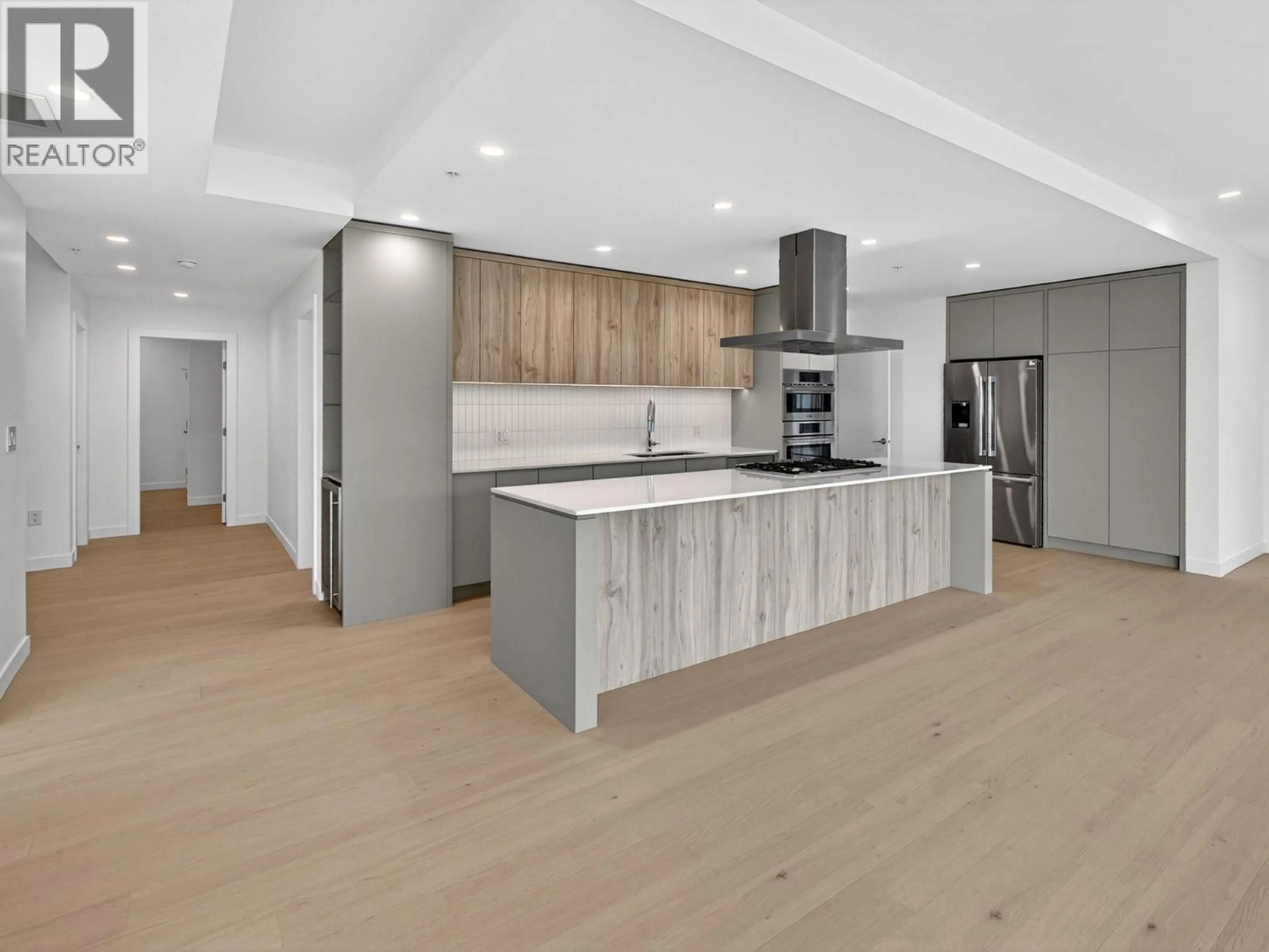 Open concept kitchen, wood/laminate floor for 202 - 13415 LAKESHORE DRIVE SOUTH, Summerland British Columbia V0H1Z1