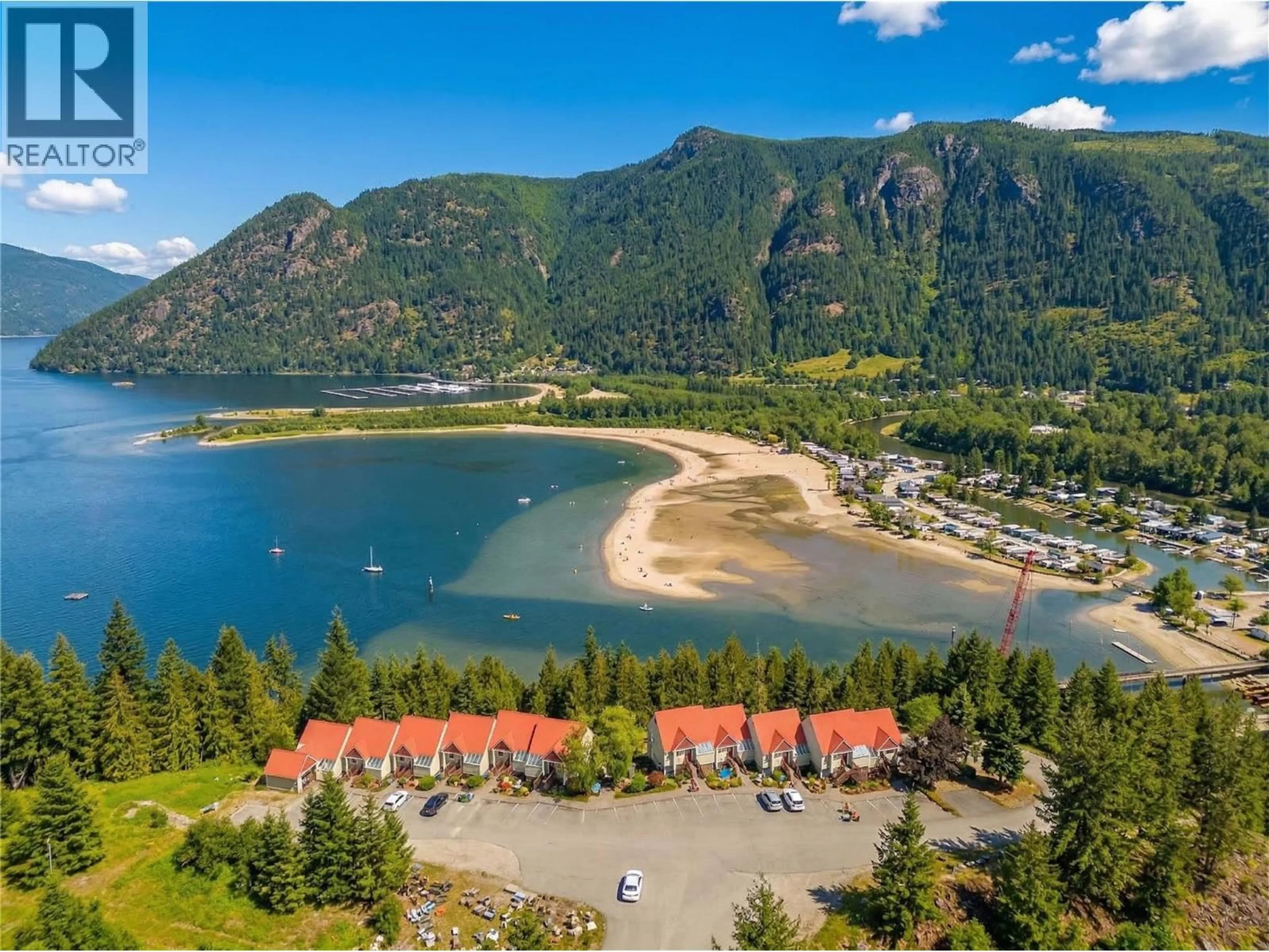 A pic from outside/outdoor area/front of a property/back of a property/a pic from drone, water/lake/river/ocean view for 203 - 500 OLD SPALLUMCHEEN ROAD, Sicamous British Columbia V0E2V3