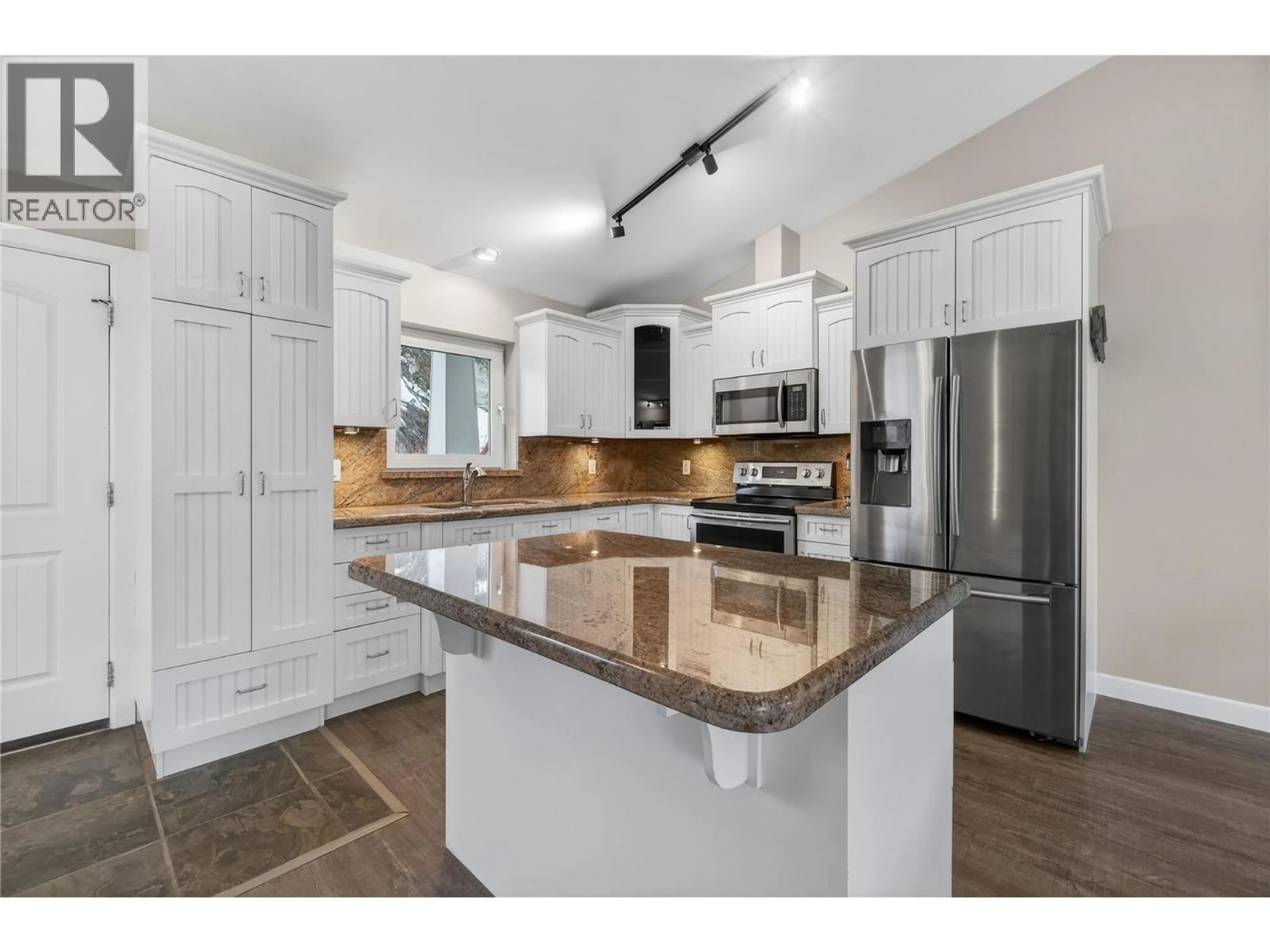 Open concept kitchen, ceramic/tile floor for 203 - 500 OLD SPALLUMCHEEN ROAD, Sicamous British Columbia V0E2V3