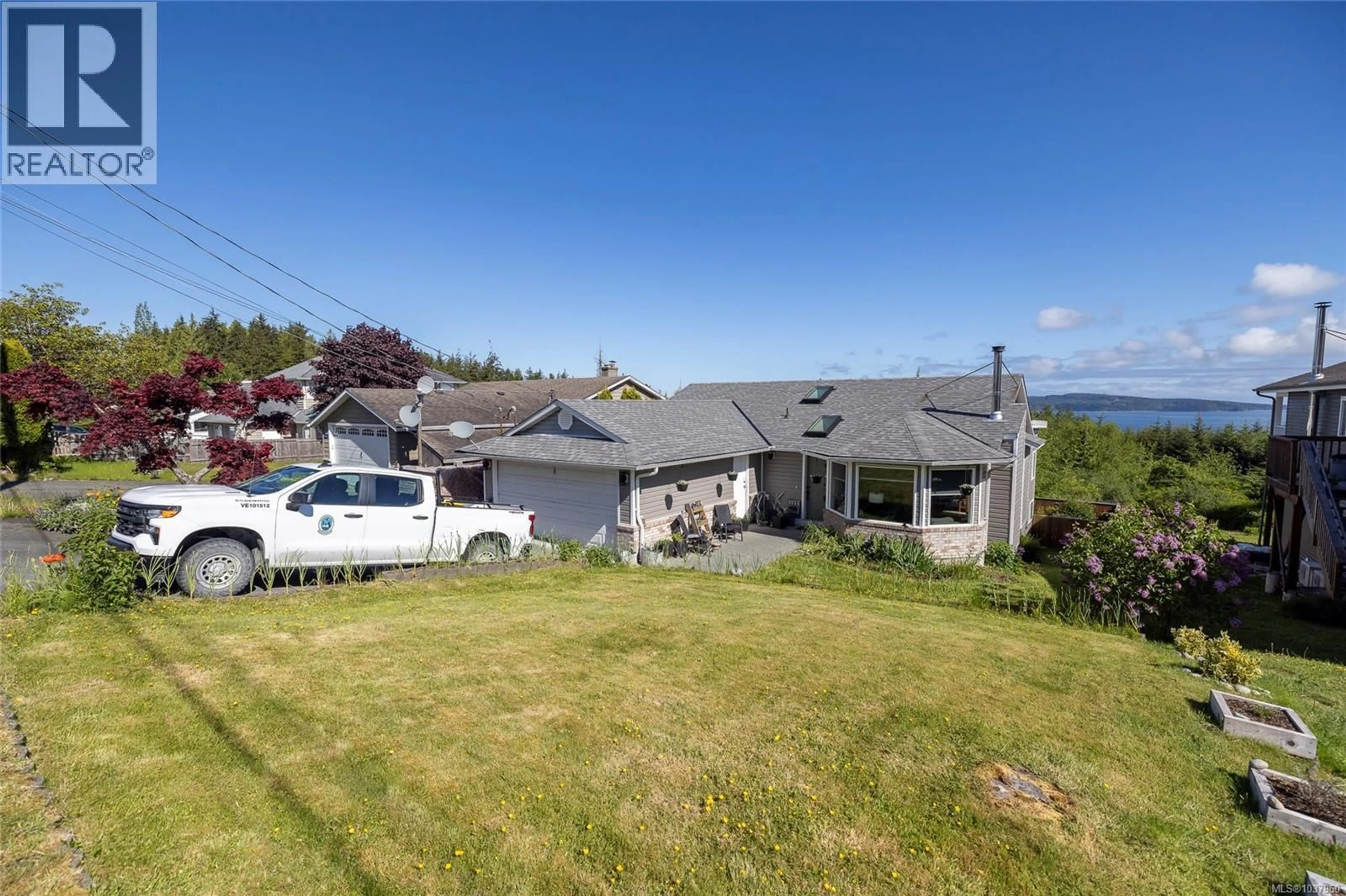 A pic from outside/outdoor area/front of a property/back of a property/a pic from drone, street for 2874 WOODLAND DRIVE, Port McNeill British Columbia V0N2R0
