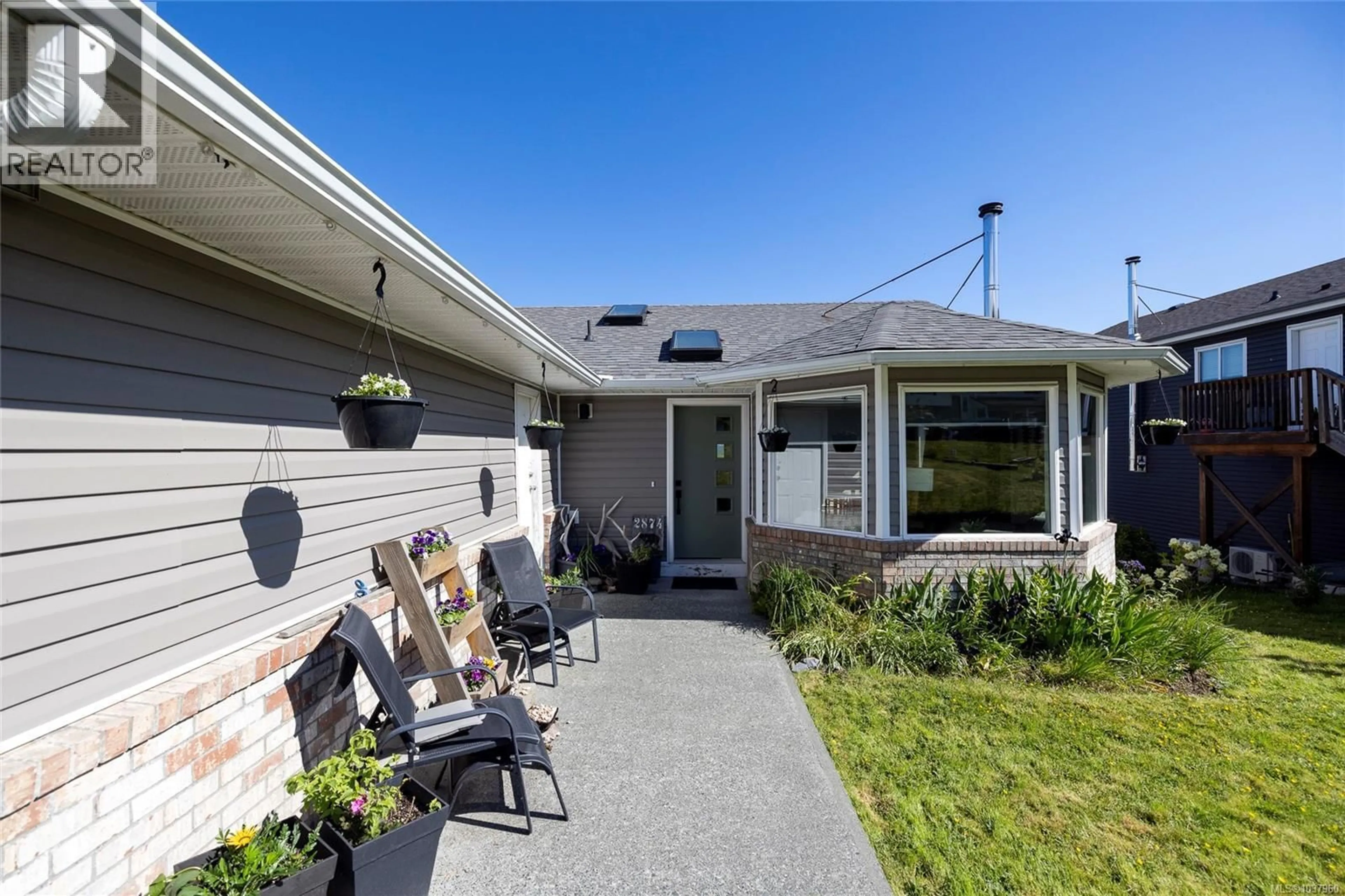 Home with vinyl exterior material, street for 2874 WOODLAND DRIVE, Port McNeill British Columbia V0N2R0