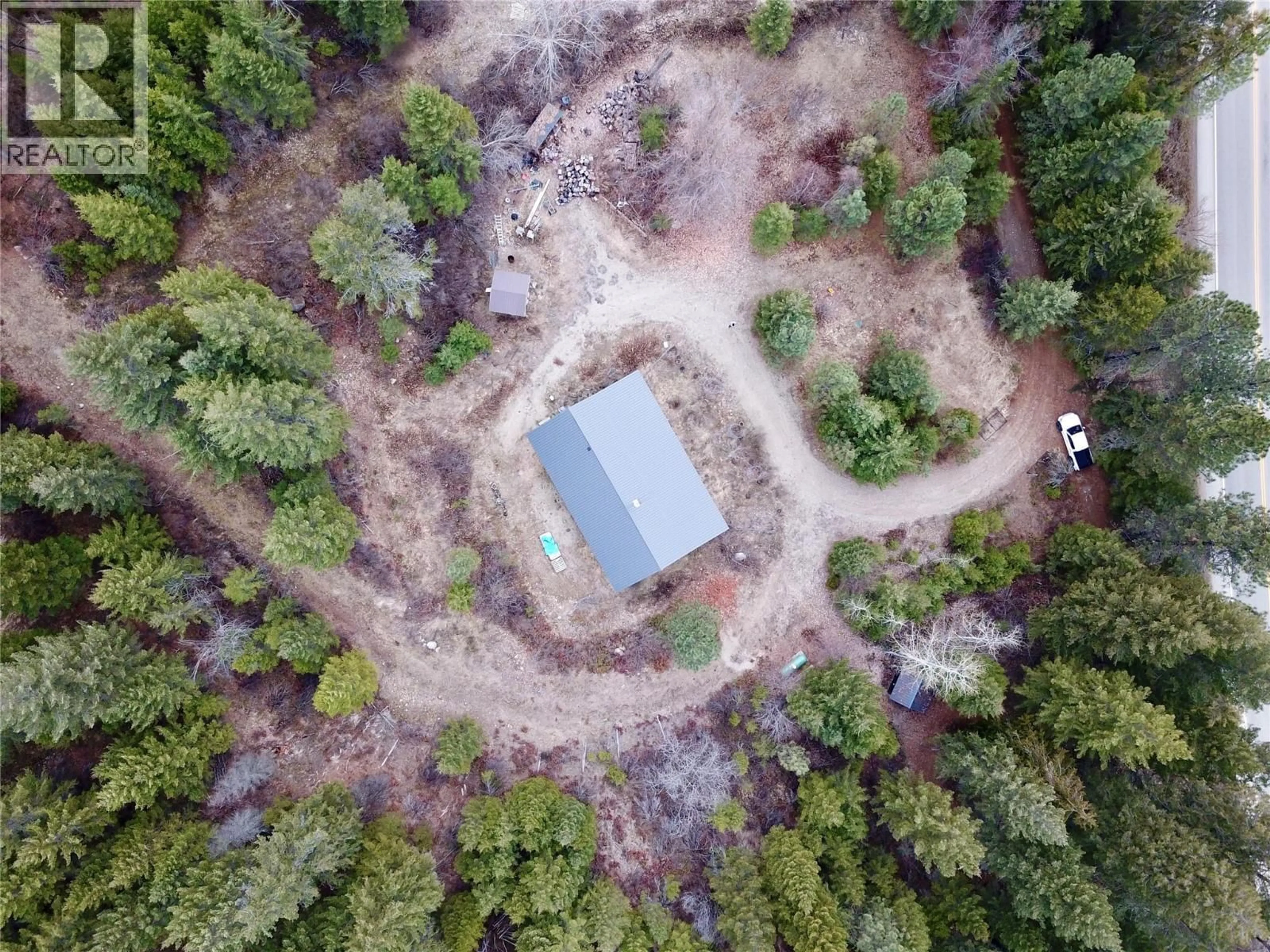 A pic from outside/outdoor area/front of a property/back of a property/a pic from drone, forest/trees view for 2160 3 HIGHWAY, Christina Lake British Columbia V0H1E3