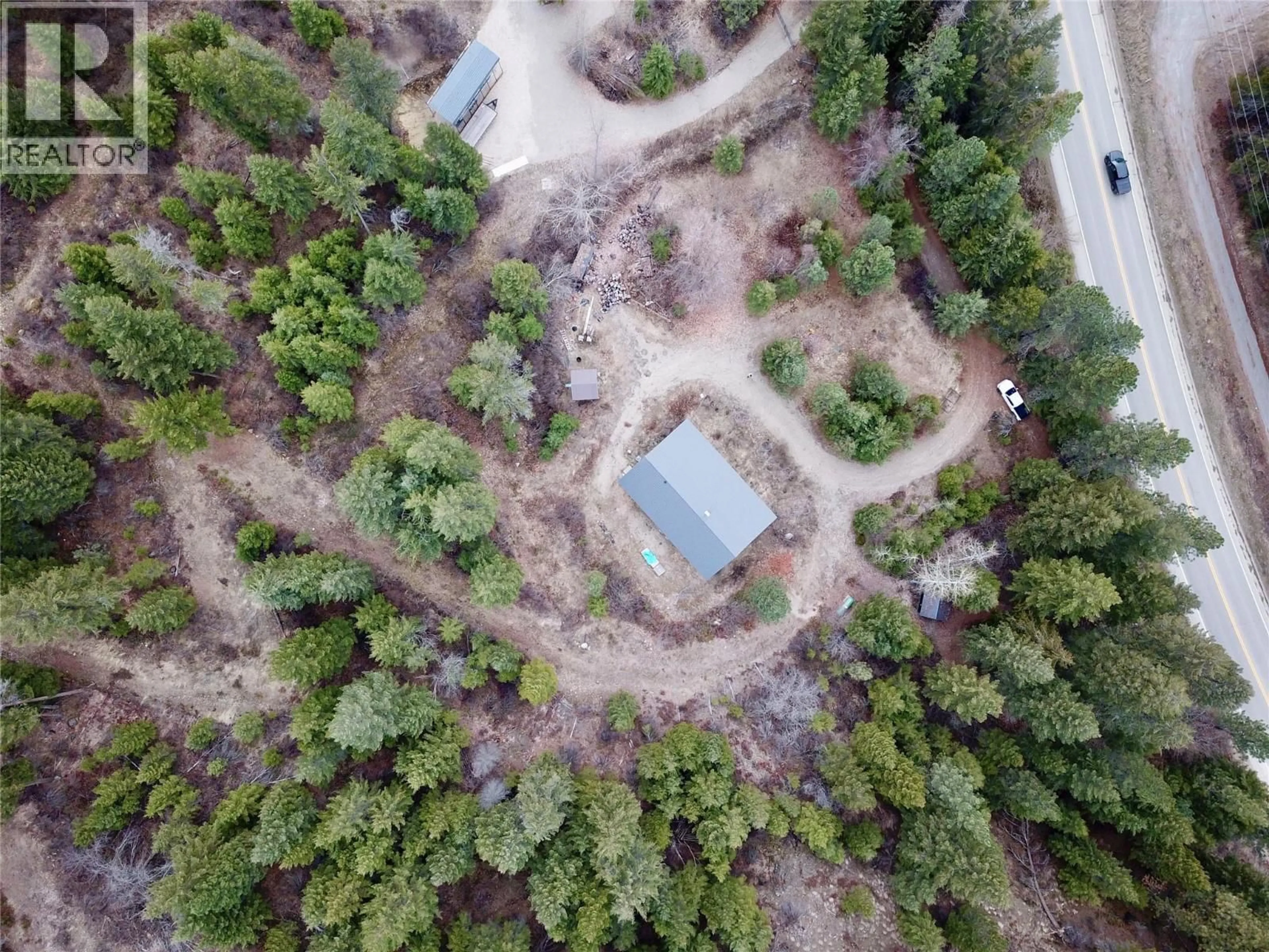 A pic from outside/outdoor area/front of a property/back of a property/a pic from drone, forest/trees view for 2160 3 HIGHWAY, Christina Lake British Columbia V0H1E3