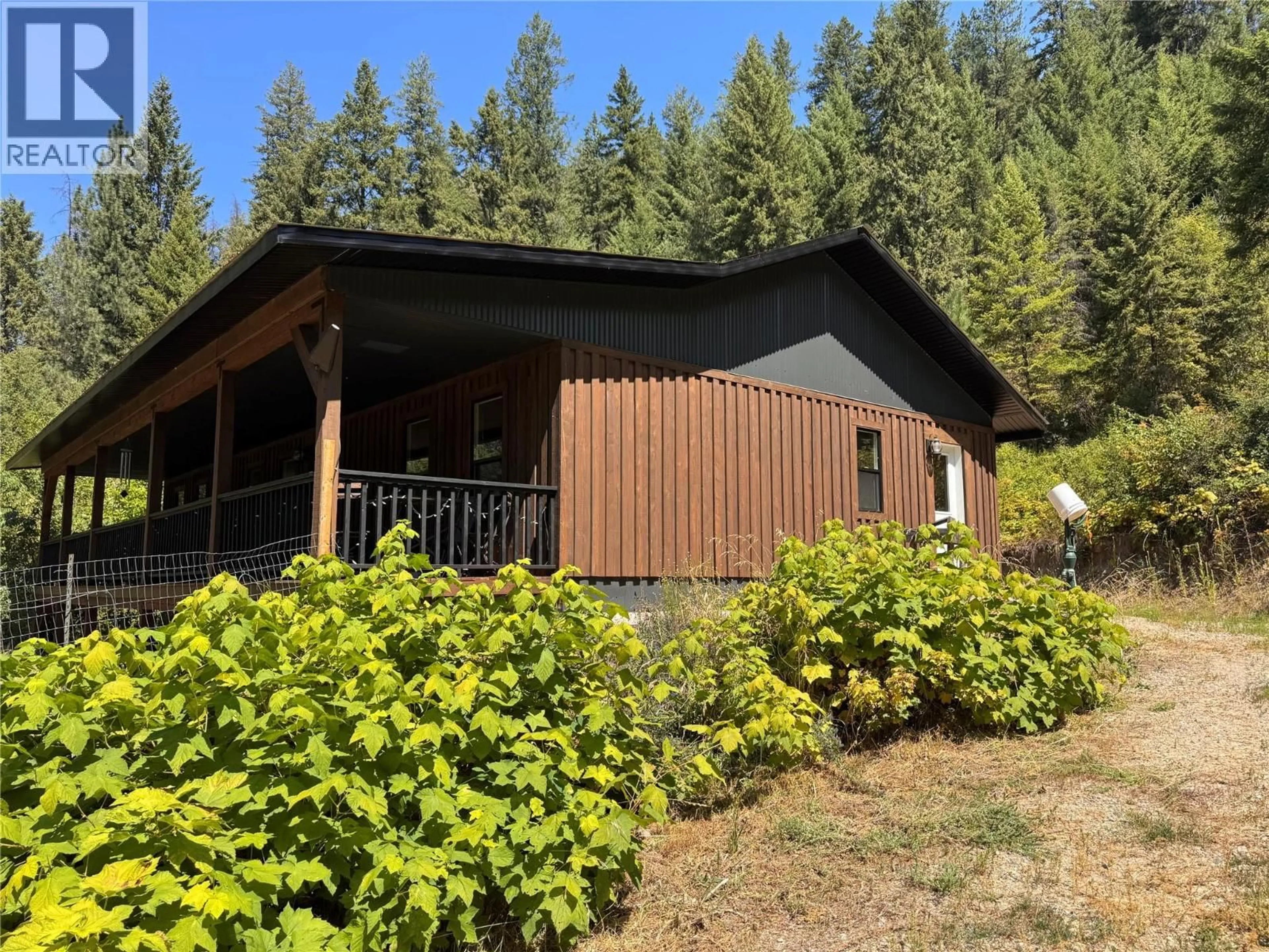 A pic from outside/outdoor area/front of a property/back of a property/a pic from drone, forest/trees view for 2160 3 HIGHWAY, Christina Lake British Columbia V0H1E3
