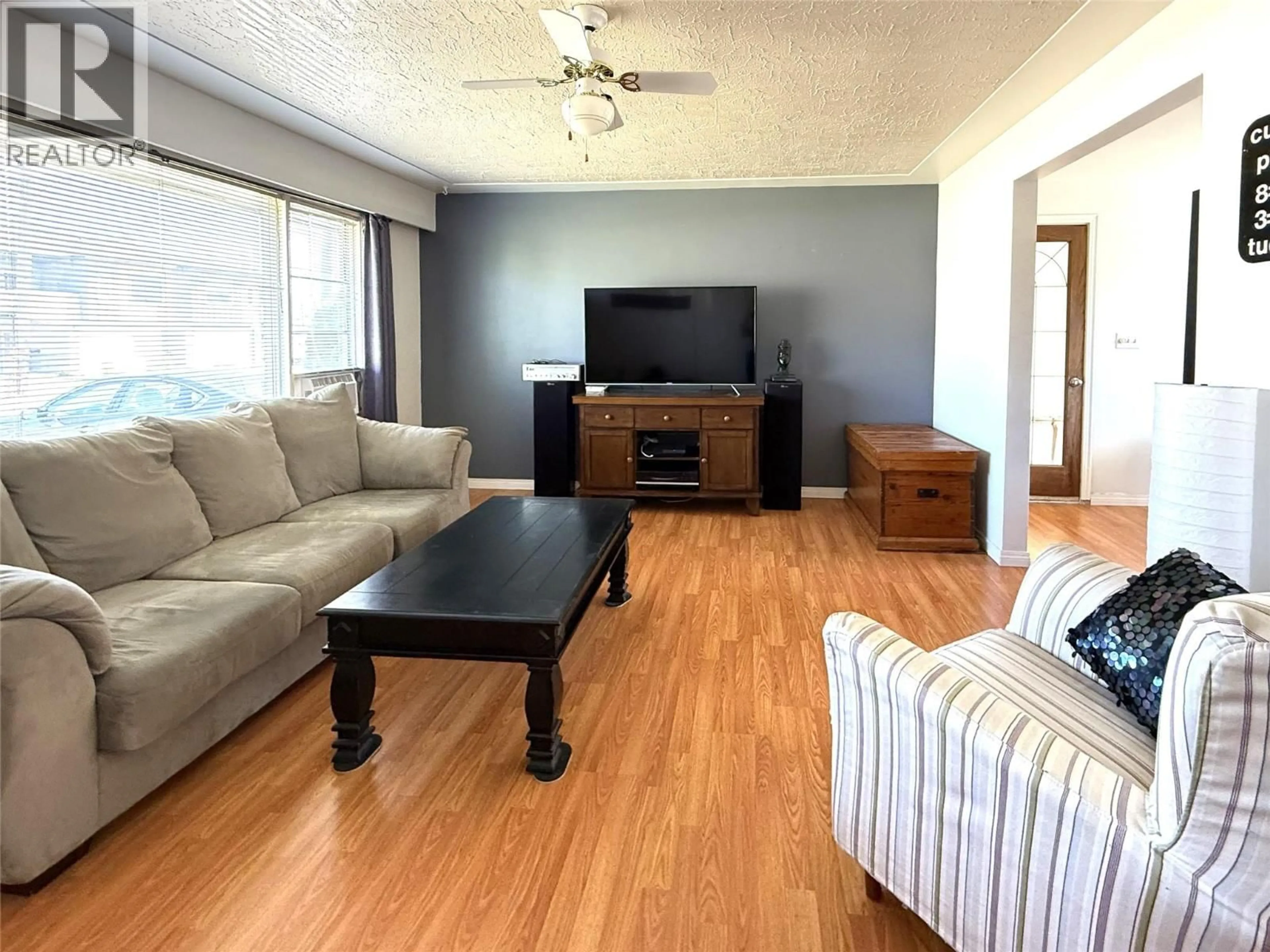 Living room with furniture, wood/laminate floor for 1359 HAMILTON STREET, Kamloops British Columbia V2B2V3