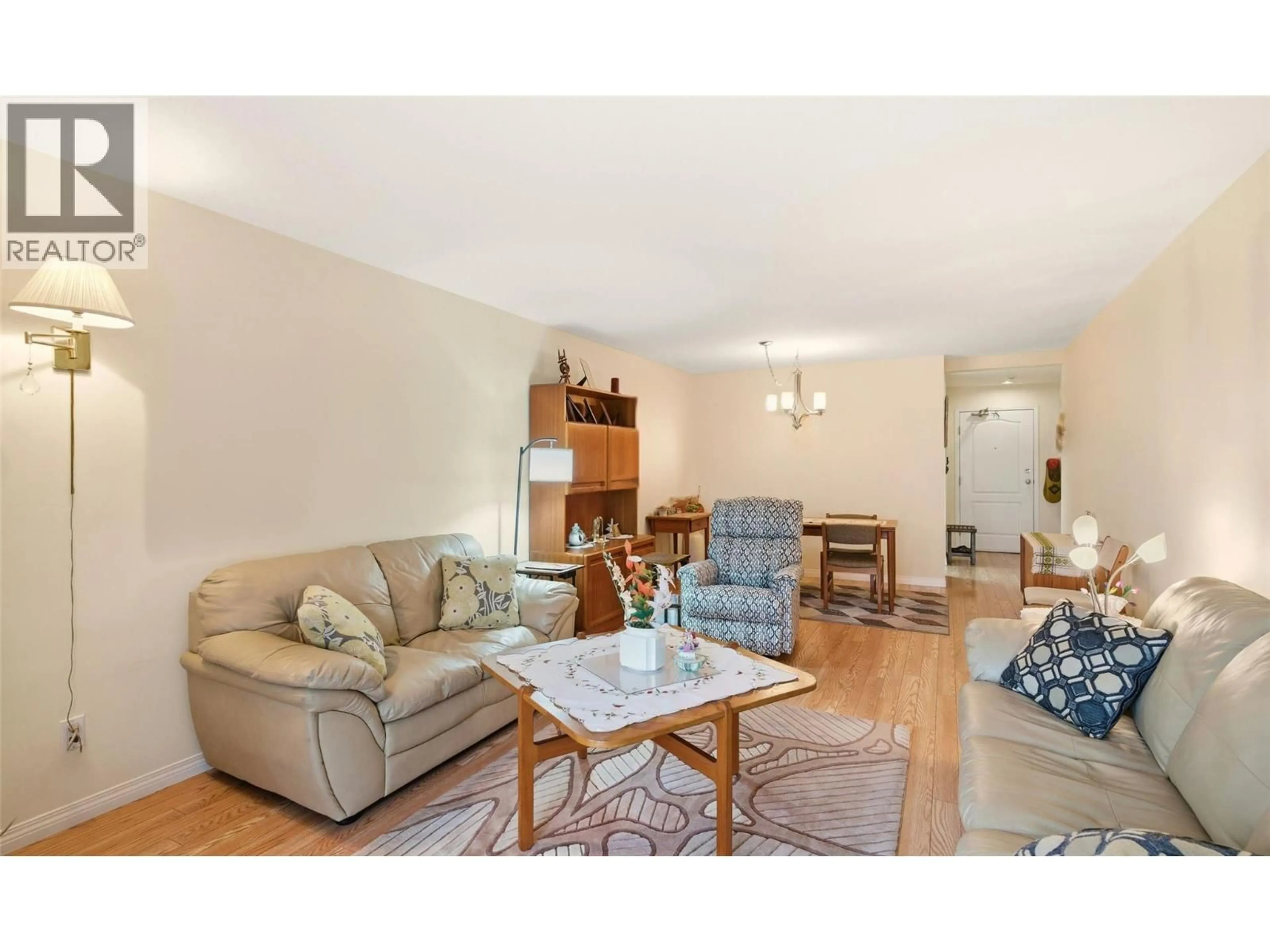 Living room with furniture, wood/laminate floor for 116 - 1965 DURNIN ROAD, Kelowna British Columbia V1X7K6
