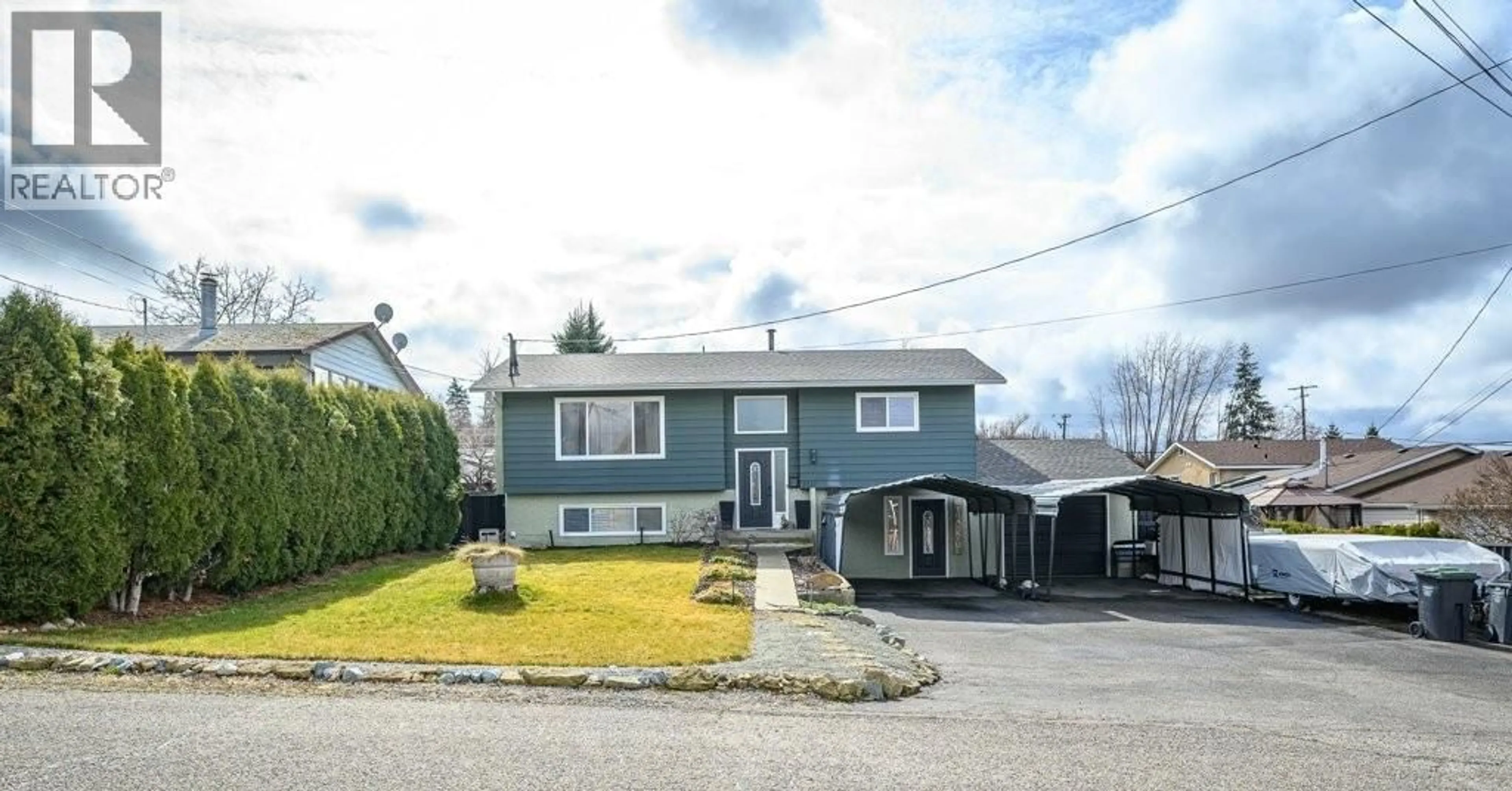 Home with vinyl exterior material, street for 3211 ESQUIRE ROAD, Ellison British Columbia V1X6M9