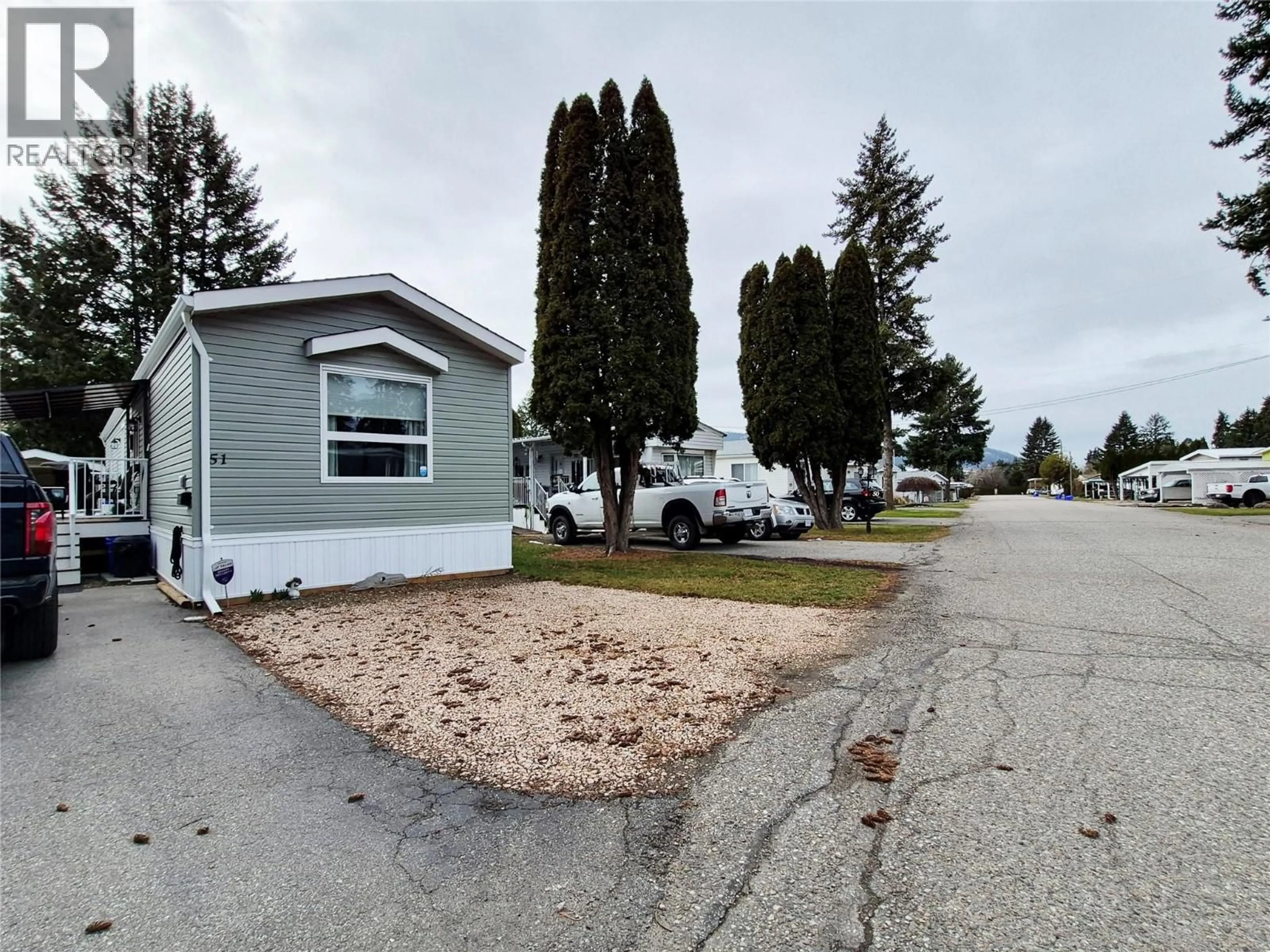 A pic from outside/outdoor area/front of a property/back of a property/a pic from drone, street for 51 - 5484 OKANAGAN LANDING ROAD, Vernon British Columbia V1T7A8