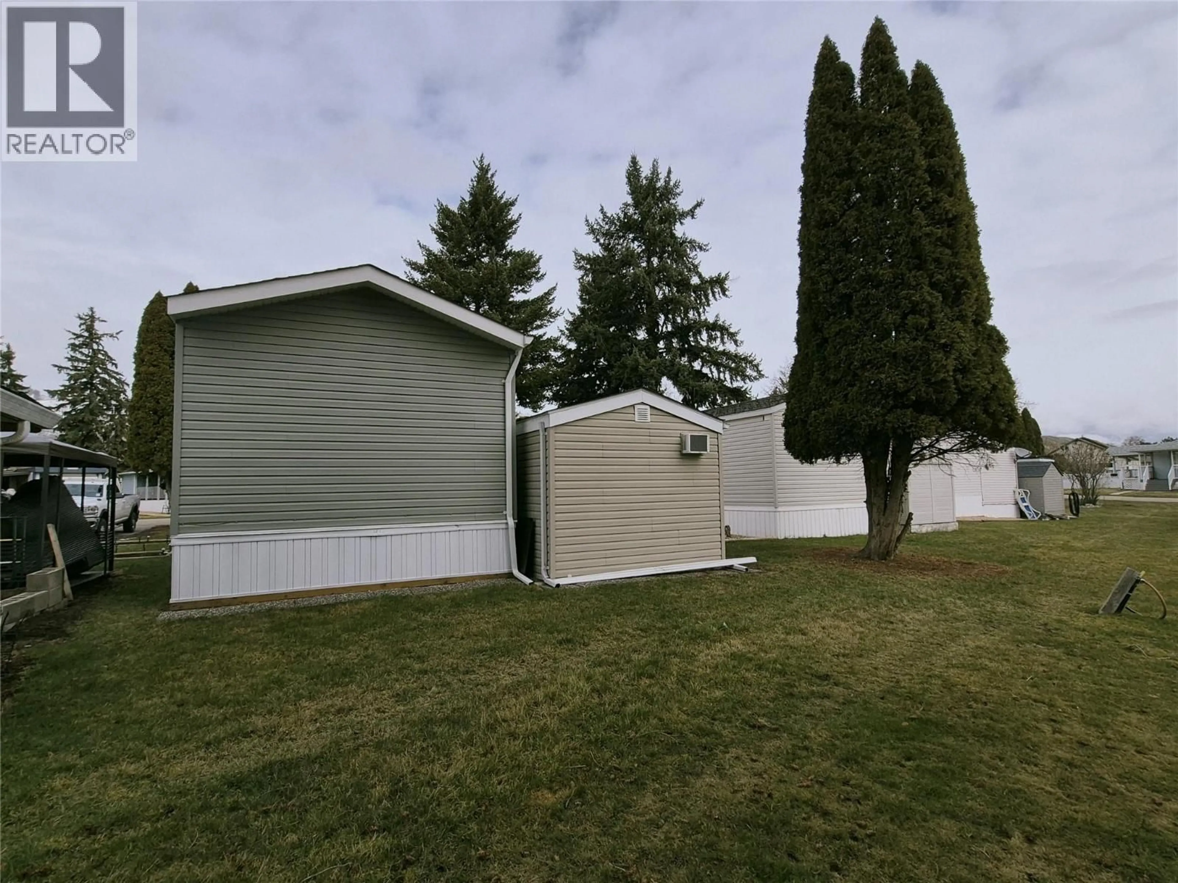 Home with vinyl exterior material, street for 51 - 5484 OKANAGAN LANDING ROAD, Vernon British Columbia V1T7A8