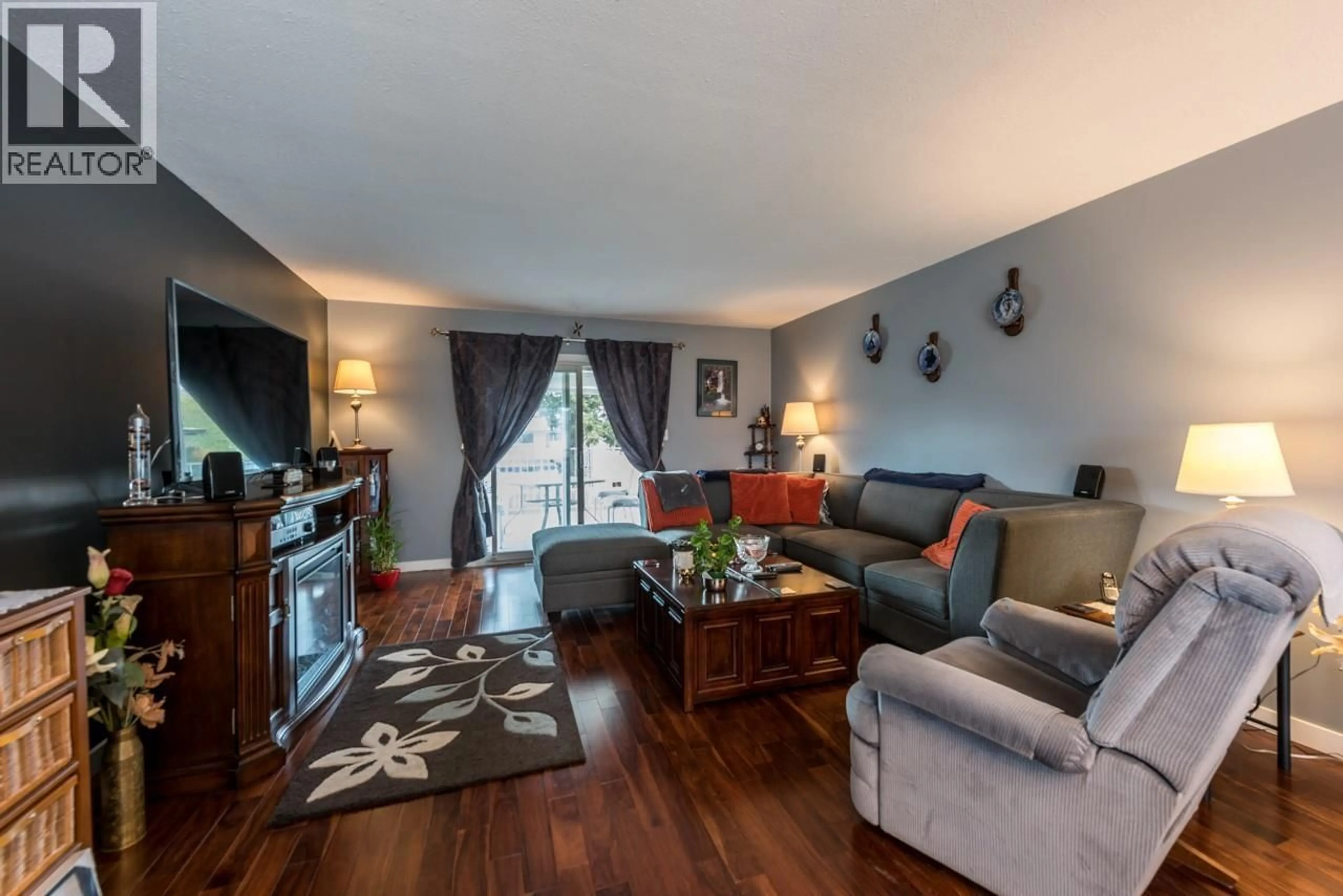Living room with furniture, wood/laminate floor for 1172 KAMWOOD PLACE, Kamloops British Columbia V2B8J9