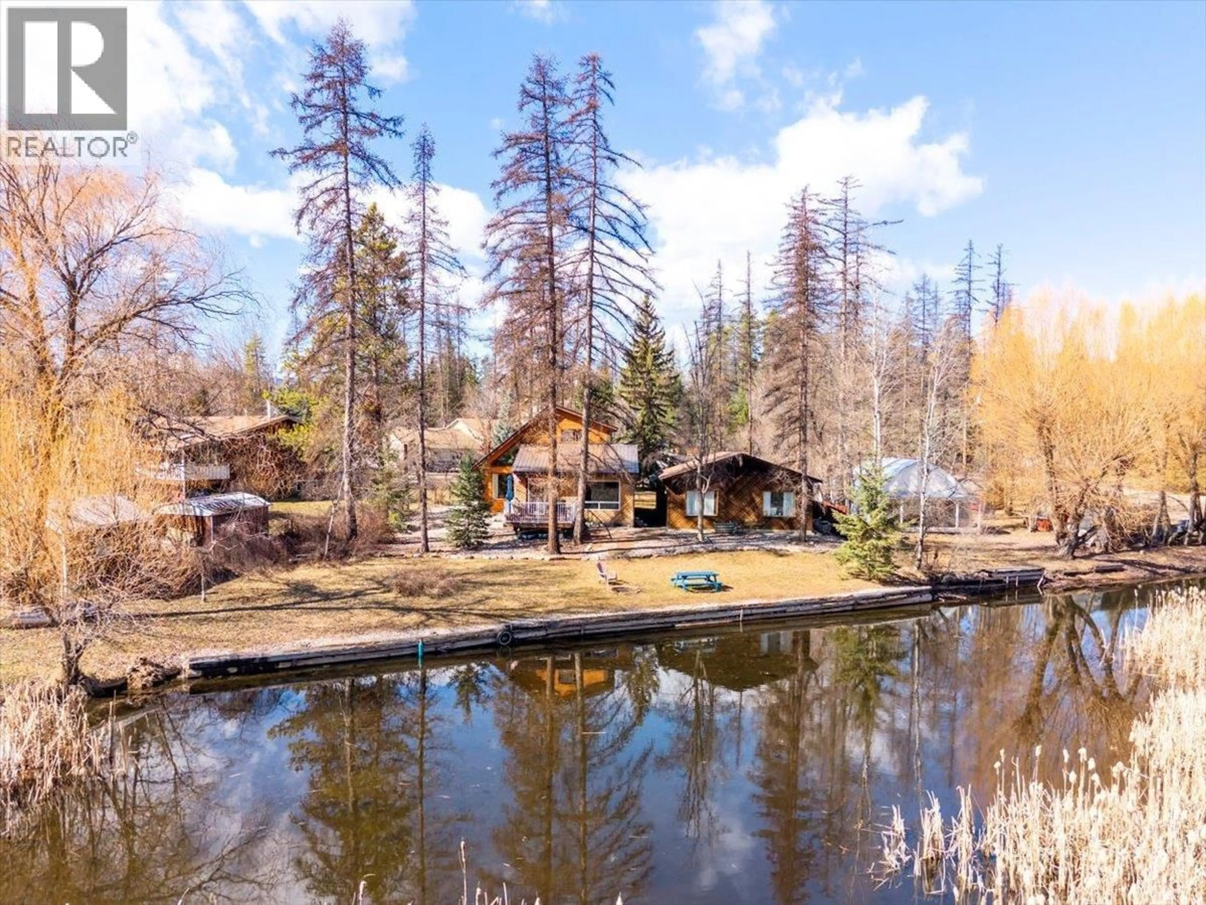 A pic from outside/outdoor area/front of a property/back of a property/a pic from drone, forest/trees view for 1536 TIE LAKE LOOP RD. N ROAD, Jaffray British Columbia V0B1T0