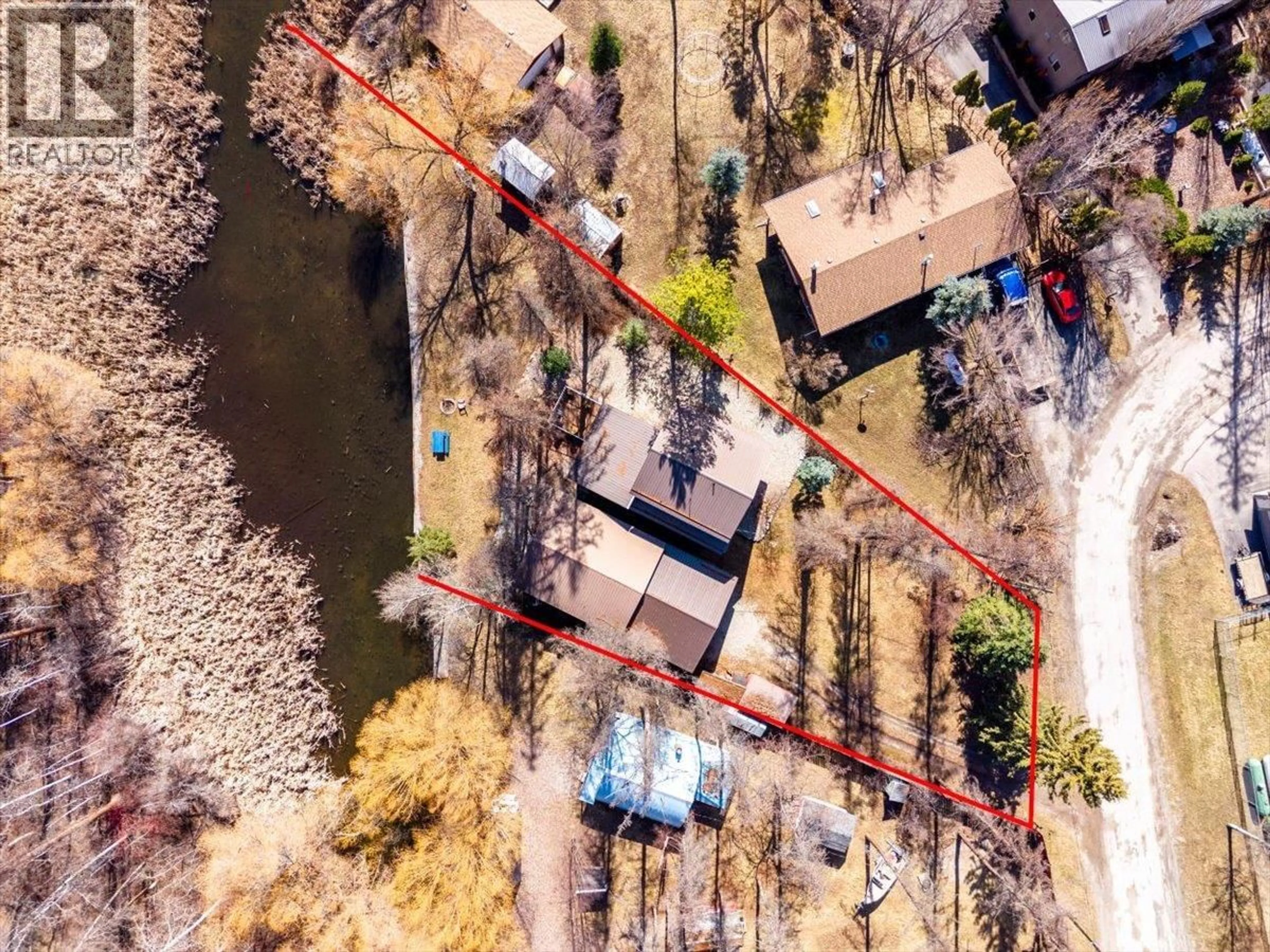 A pic from outside/outdoor area/front of a property/back of a property/a pic from drone, street for 1536 TIE LAKE LOOP RD. N ROAD, Jaffray British Columbia V0B1T0