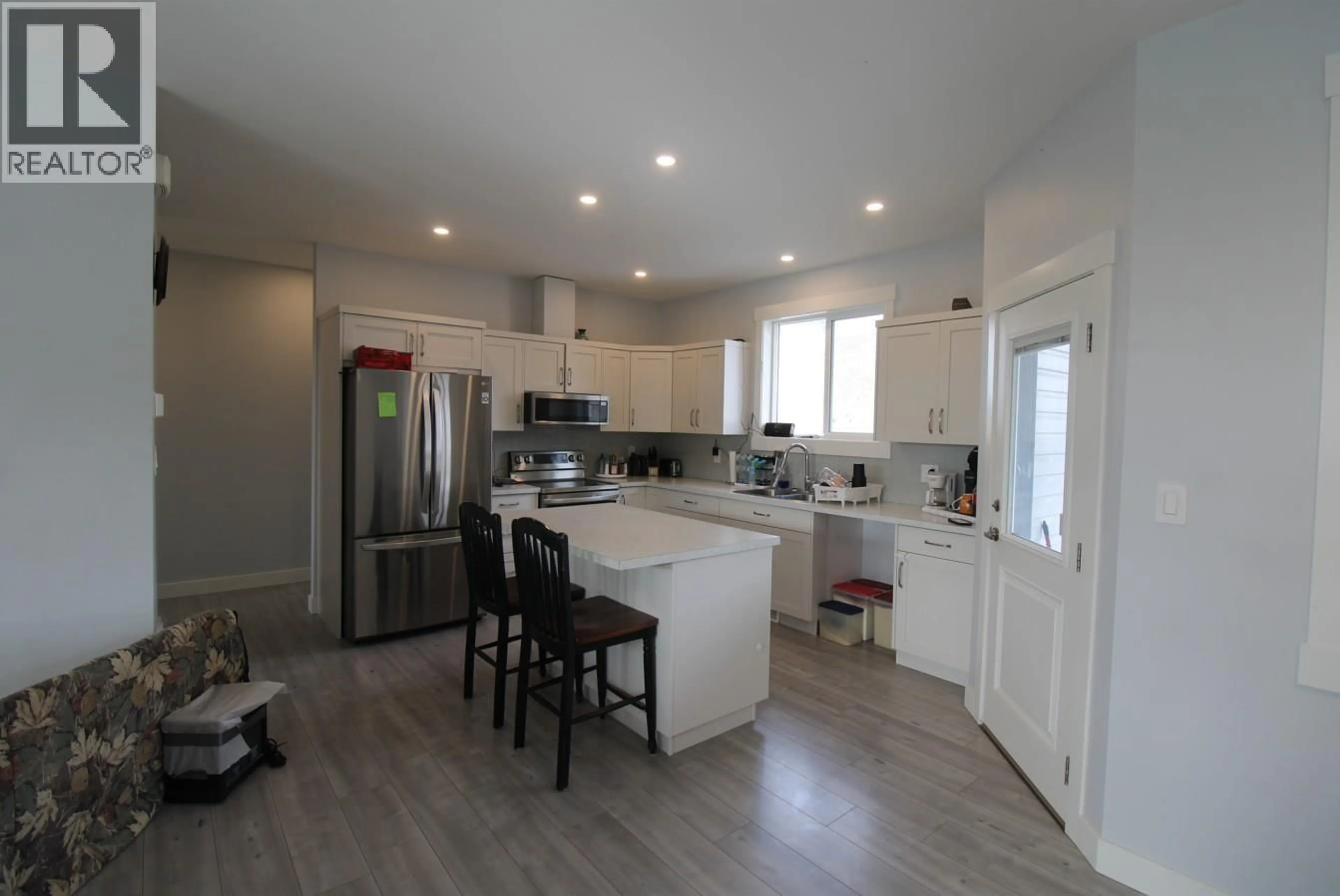 Open concept kitchen, wood/laminate floor for 461 DALADON DRIVE, Logan Lake British Columbia V0K1W0