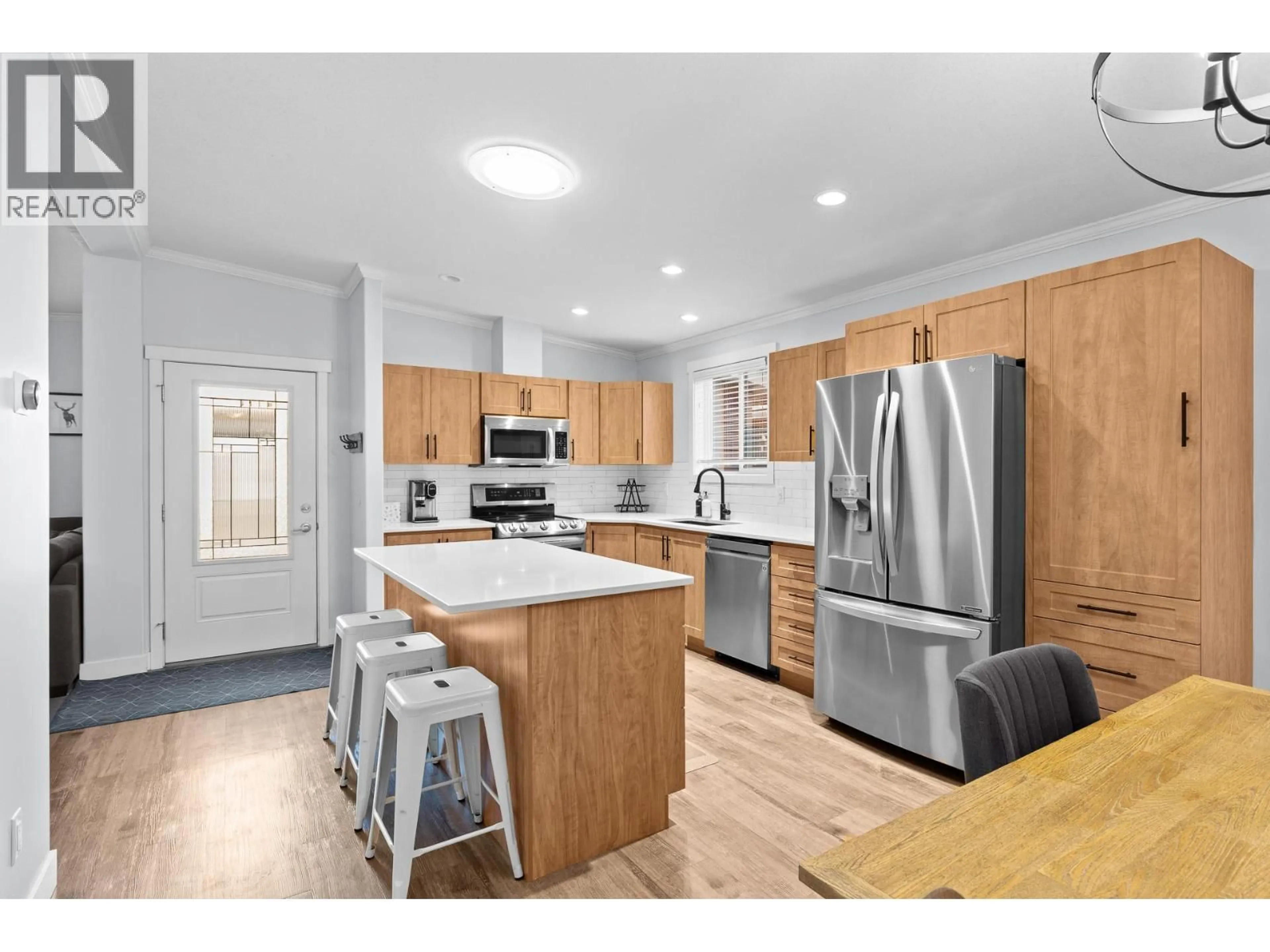 Open concept kitchen, wood/laminate floor for 35 - 1835 NANCEE WAY COURT, West Kelowna British Columbia V1Z4C1