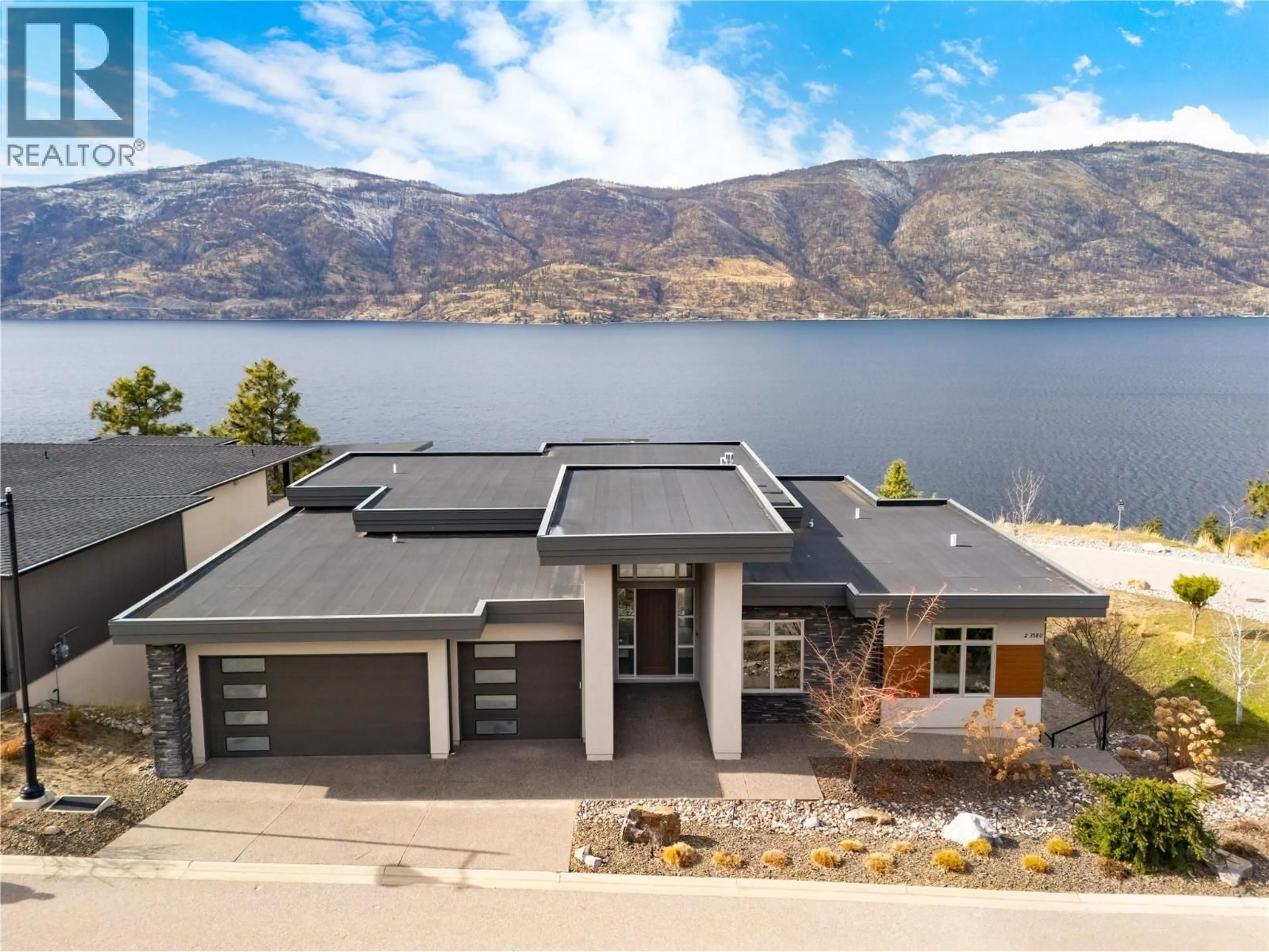A pic from outside/outdoor area/front of a property/back of a property/a pic from drone, water/lake/river/ocean view for 3580 BOXWOOD ROAD, Kelowna British Columbia V1V3G2