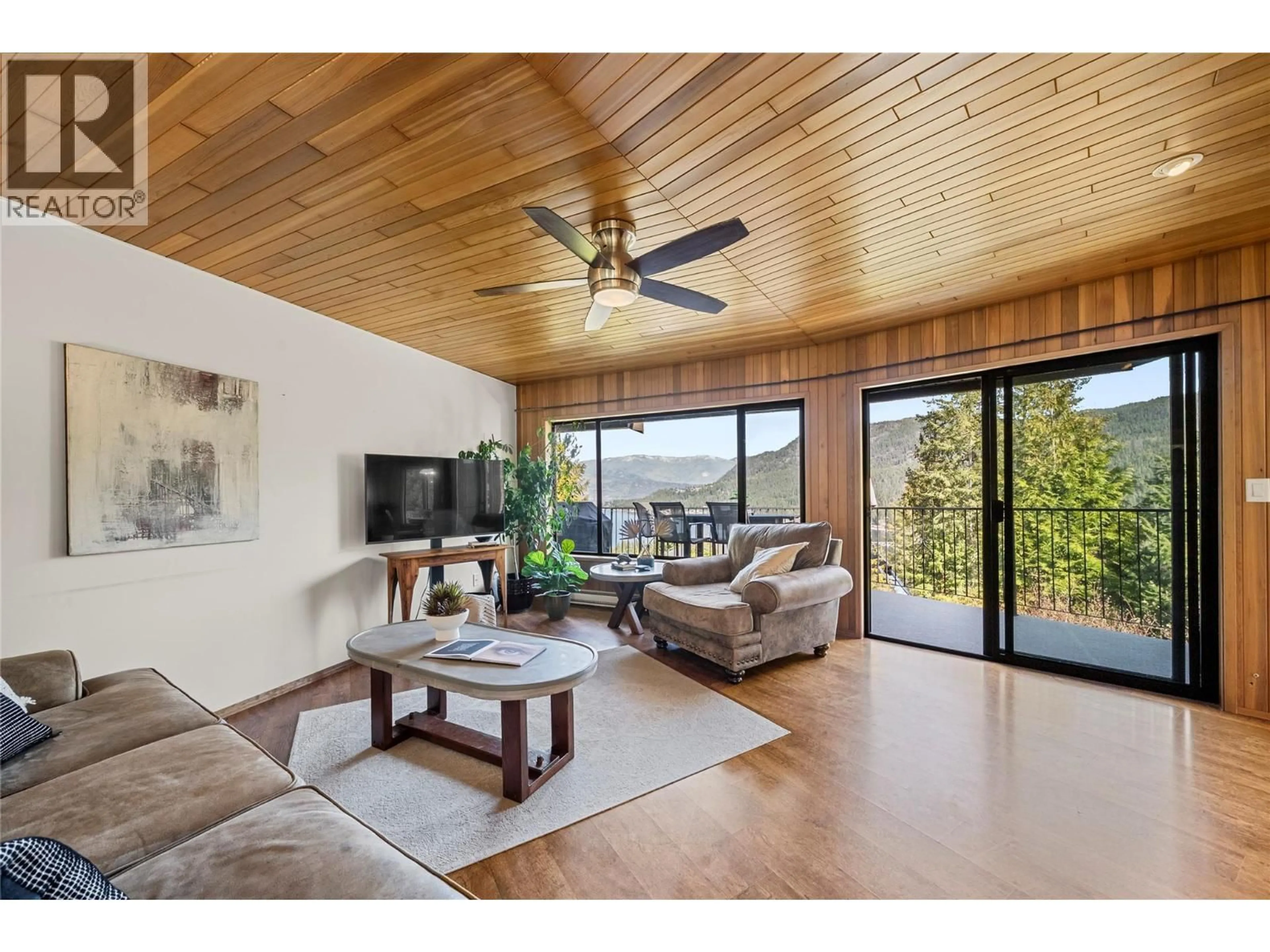 Living room with furniture, wood/laminate floor for 2631 GRAND VIEW PLACE, Blind Bay British Columbia