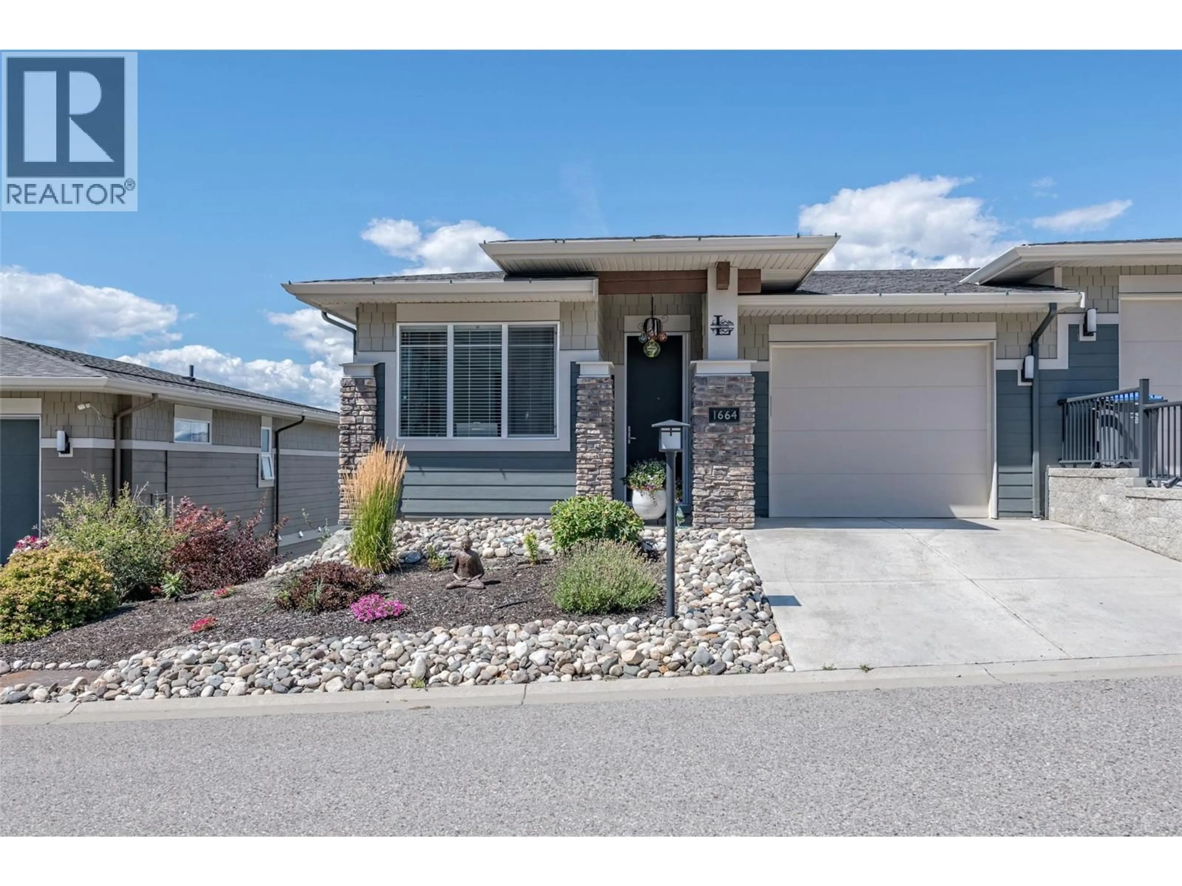 Home with vinyl exterior material, street for 1664 TOWER RANCH DRIVE, Kelowna British Columbia V1P1T8