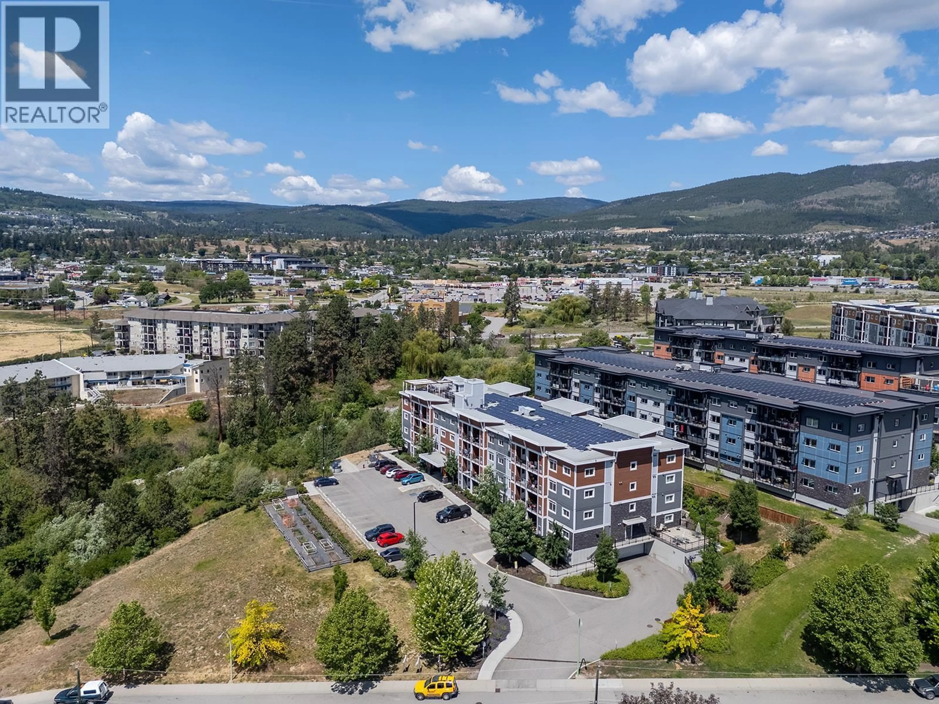 A pic from outside/outdoor area/front of a property/back of a property/a pic from drone, mountain view for 412 - 2250 MAJOROS ROAD, West Kelowna British Columbia V4T0A6