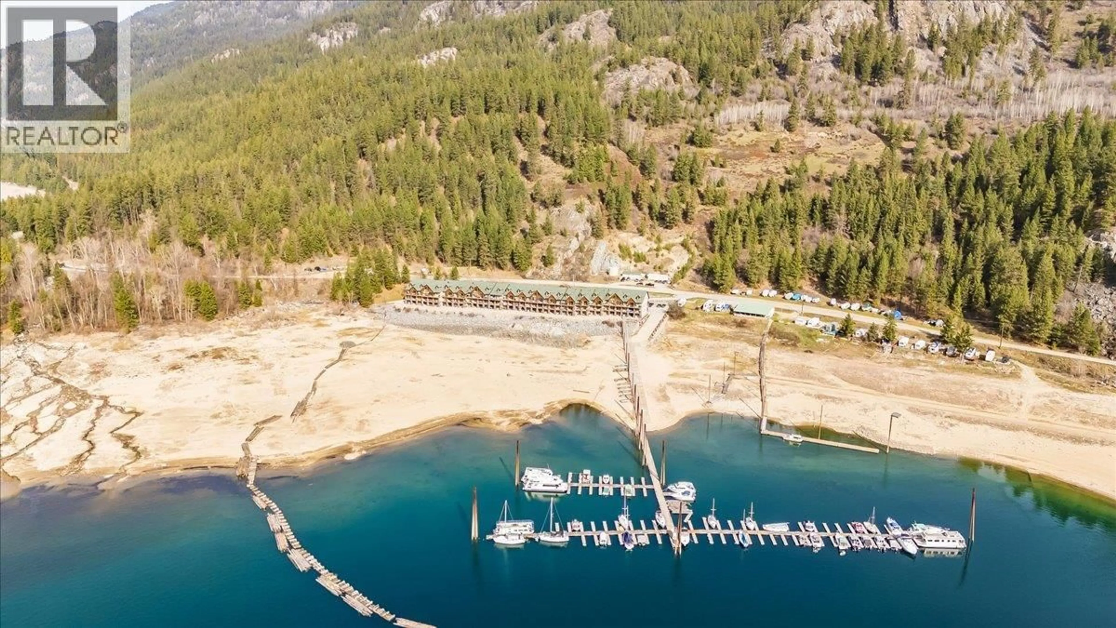 A pic from outside/outdoor area/front of a property/back of a property/a pic from drone, water/lake/river/ocean view for 117 - 5570 BROADWATER ROAD, Castlegar British Columbia V1N0A1