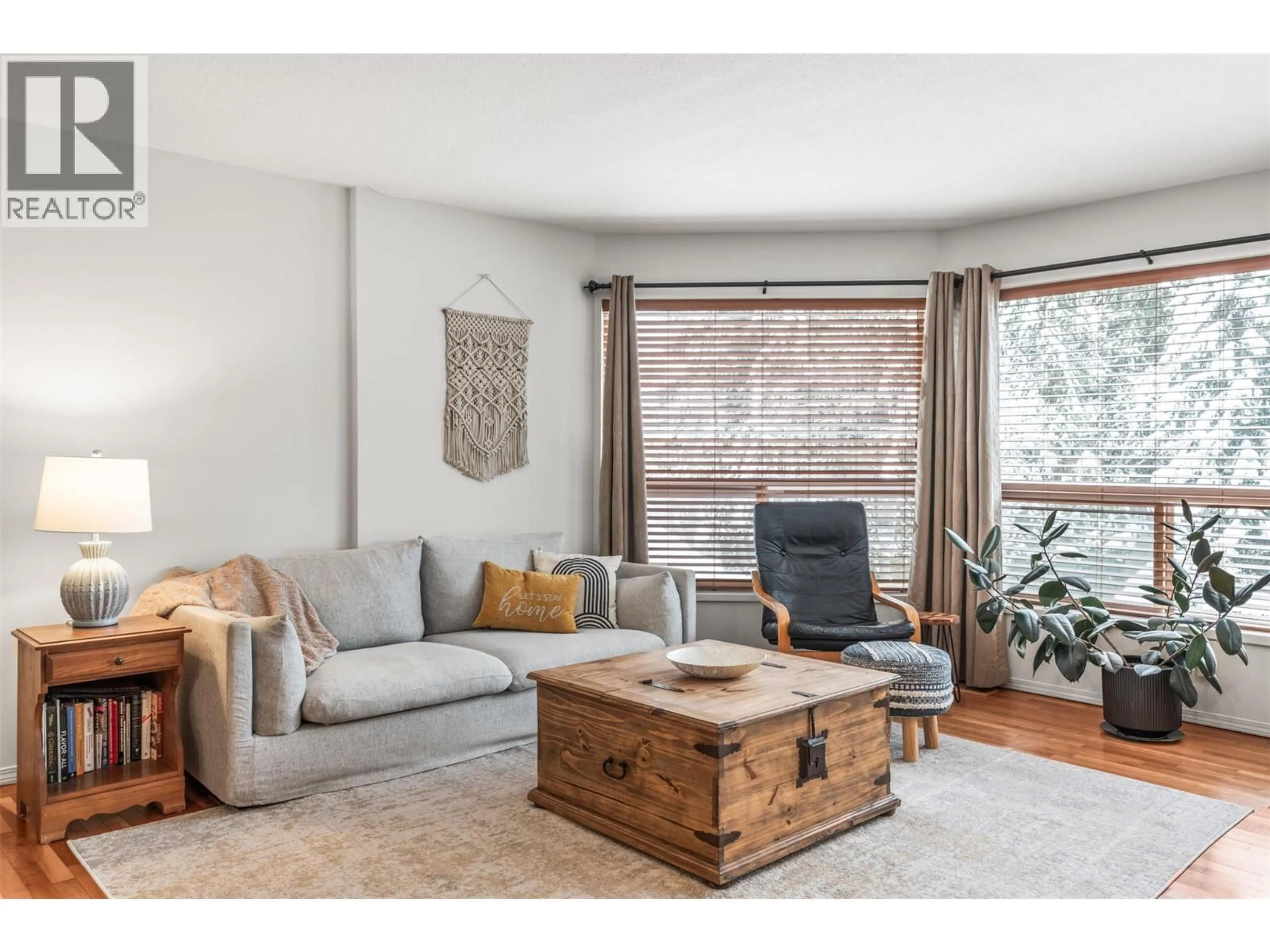 Living room with furniture, wood/laminate floor for 2287 CATT AVENUE, Lumby British Columbia V0E2G0