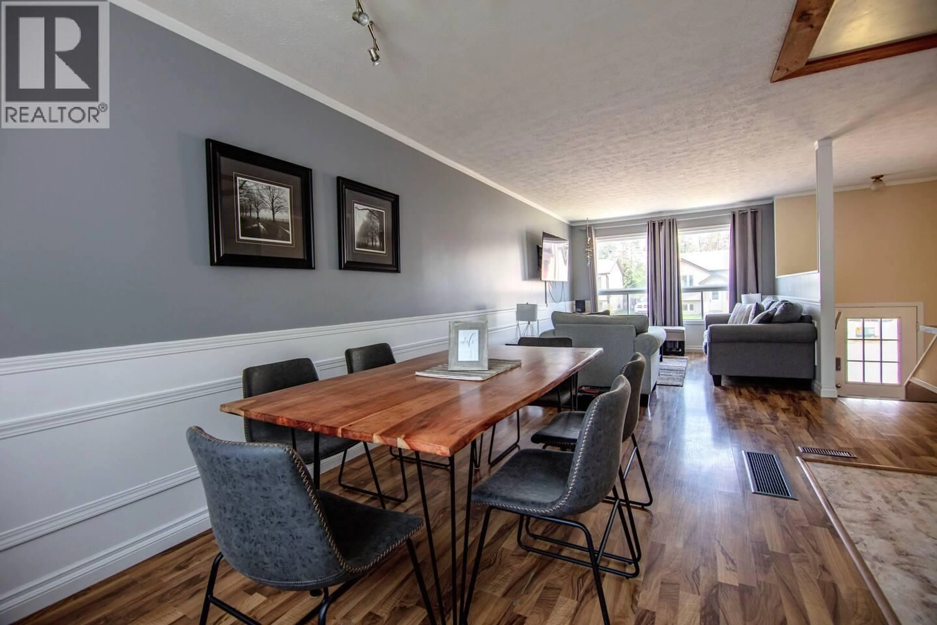 Dining room, wood/laminate floor for 116 WOLVERINE AVENUE, Tumbler Ridge British Columbia V0C2W0